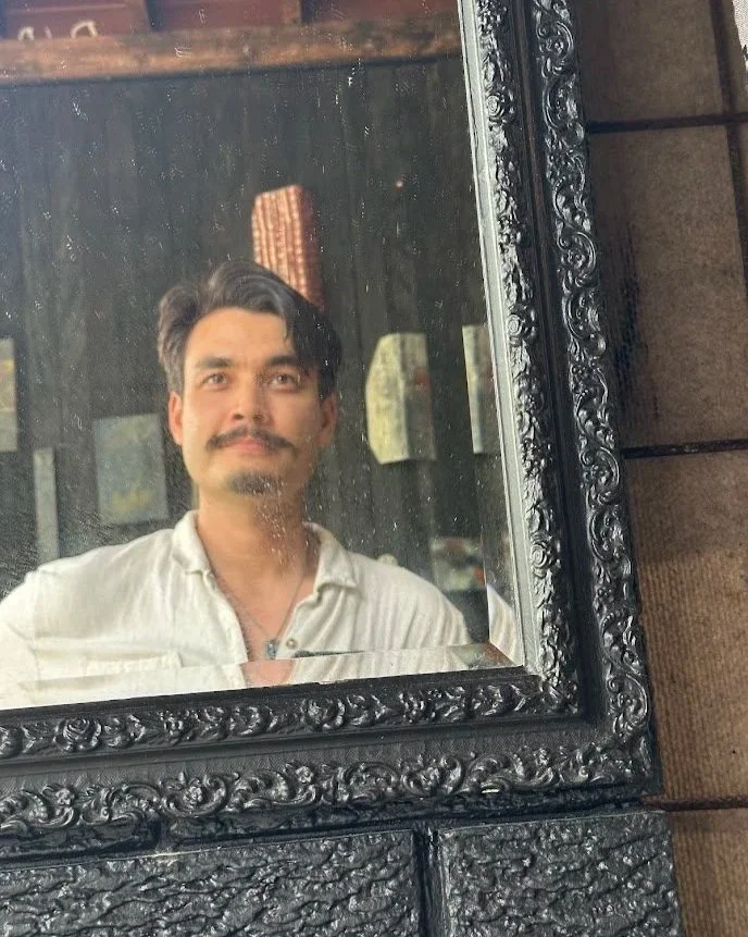Daniel Horne photographed within a mirror