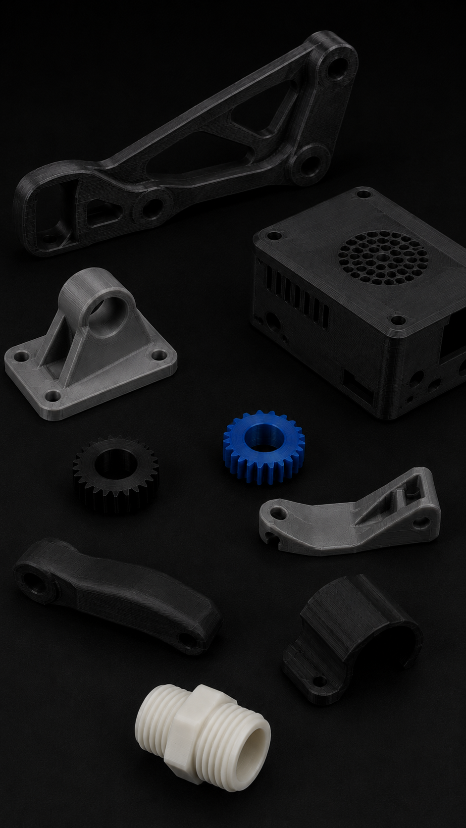 Collection of 3D-printed mechanical parts including gears, brackets, and couplings, mostly in black and gray, with one white piece and one blue gear against a black background.