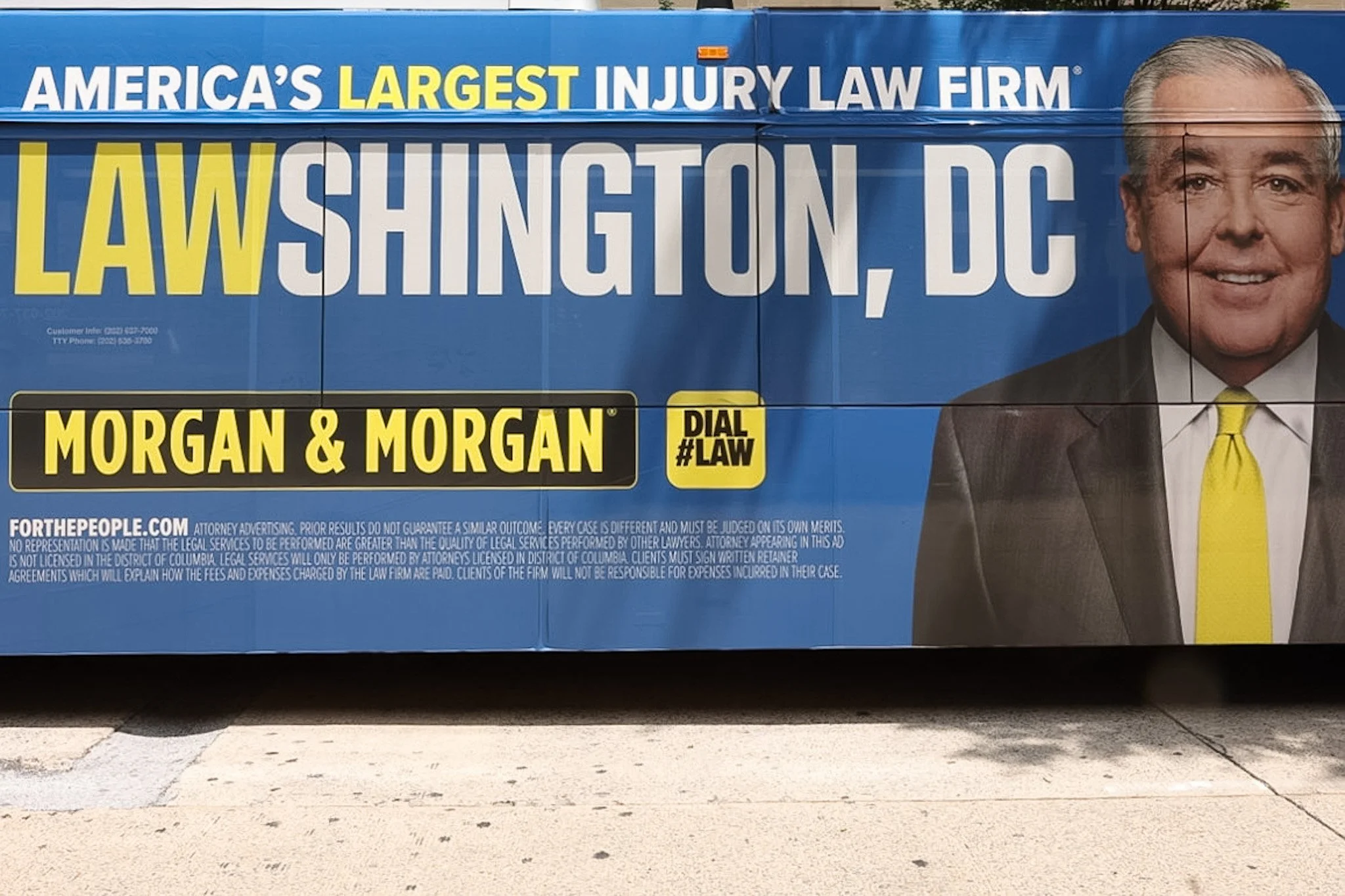 A ridiculously ironic Washington DC bus advertisement for a lawyer. ent.