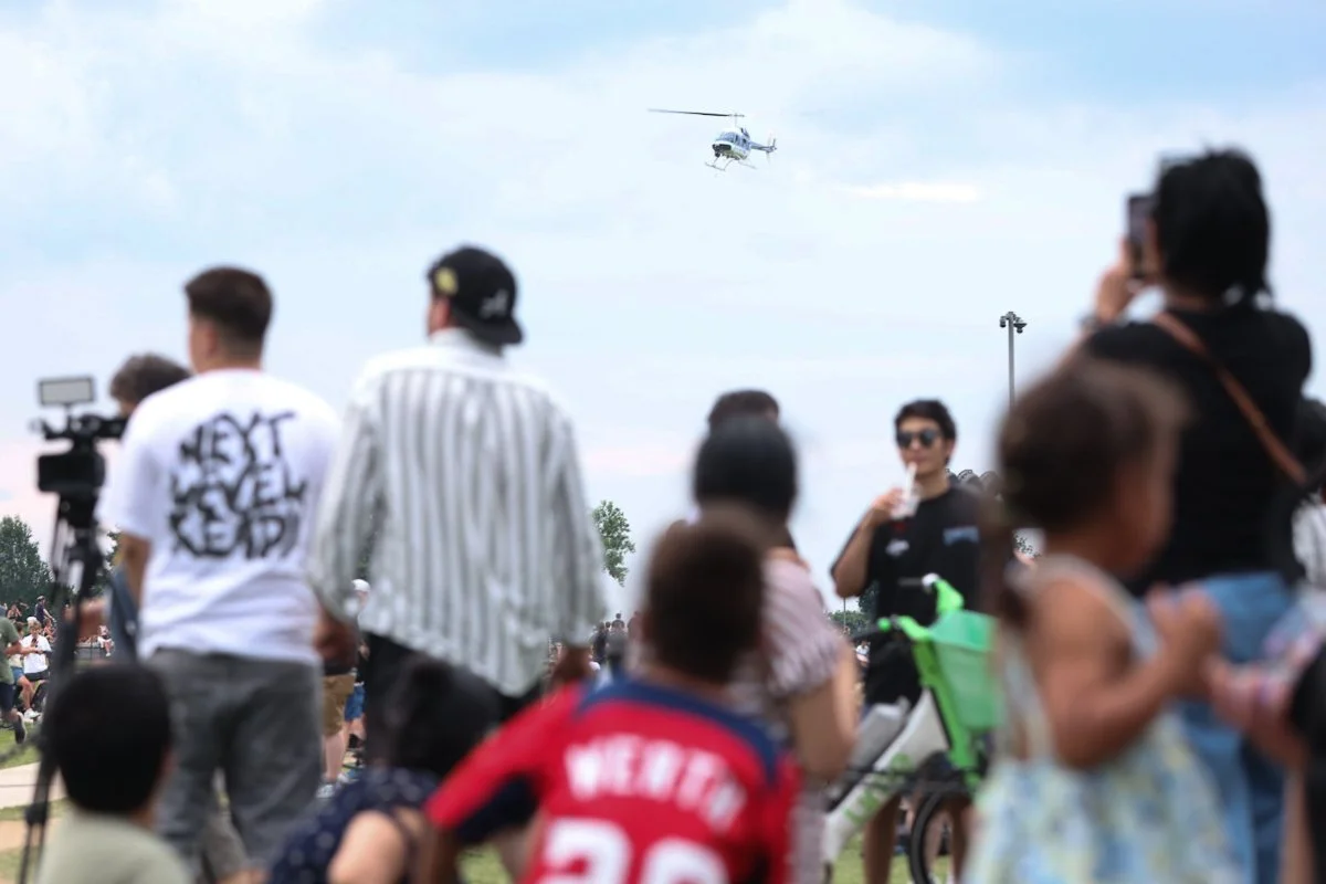 Park Police helicopter flying low over the UFC Freedom 250 crowd on the National Mall Washington DC June 14 2026