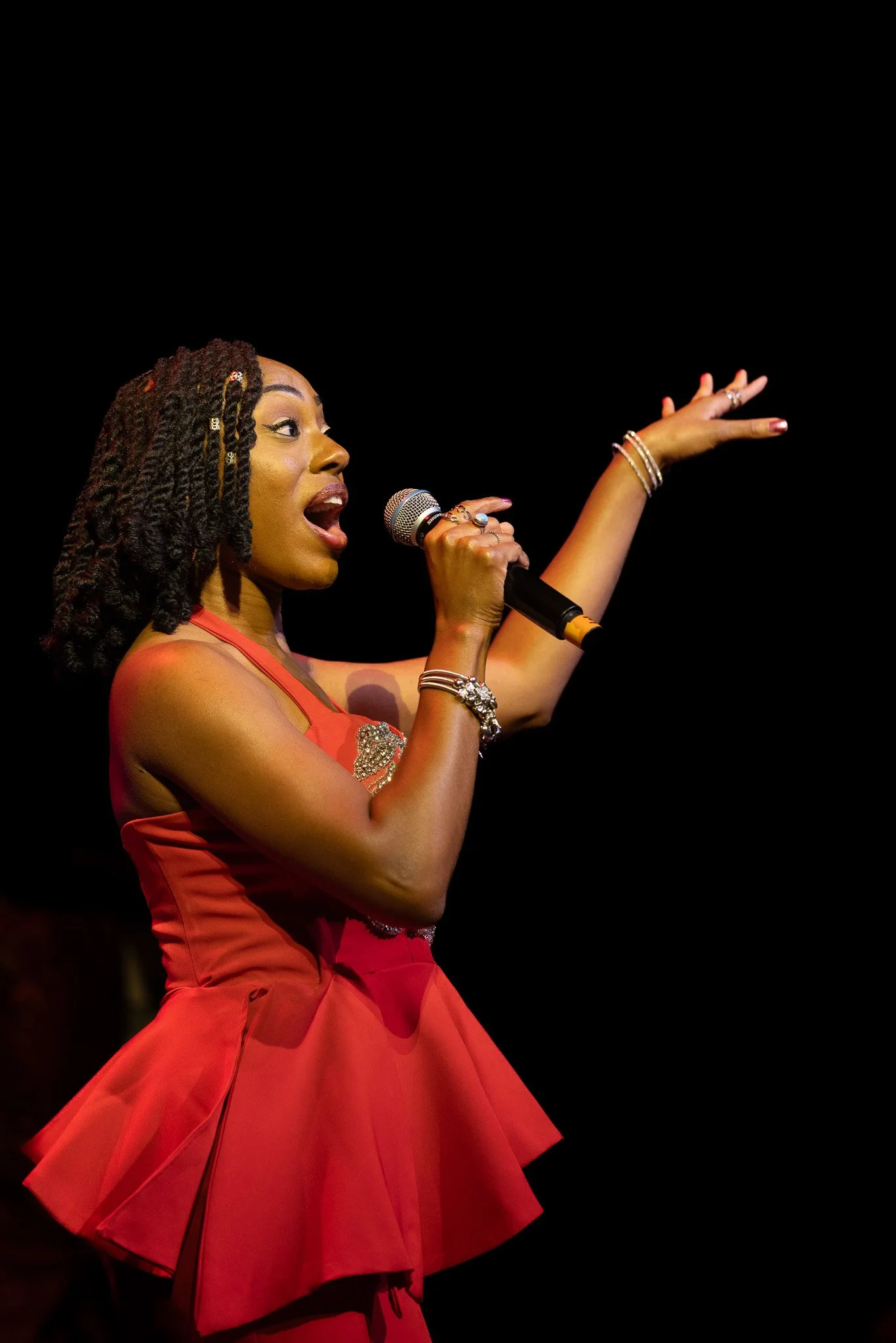 Kayla Cox singing onstage during SOS Band’s performance at Butler University’s Clowes Memorial Hall in 2026.