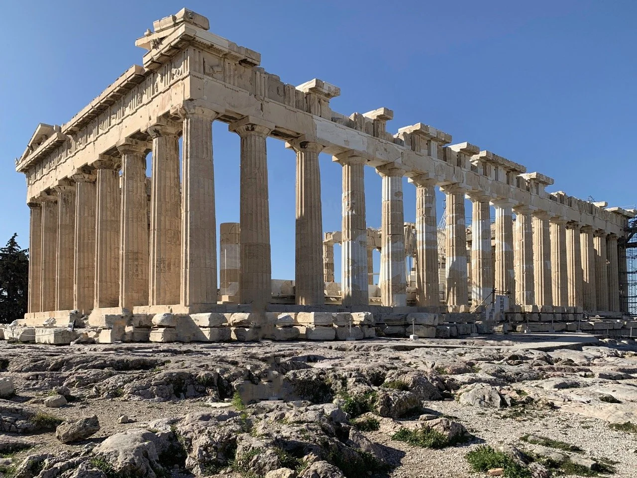 A close up photograph of the Parthenon in Athens Greece with no one on the Acropolis.