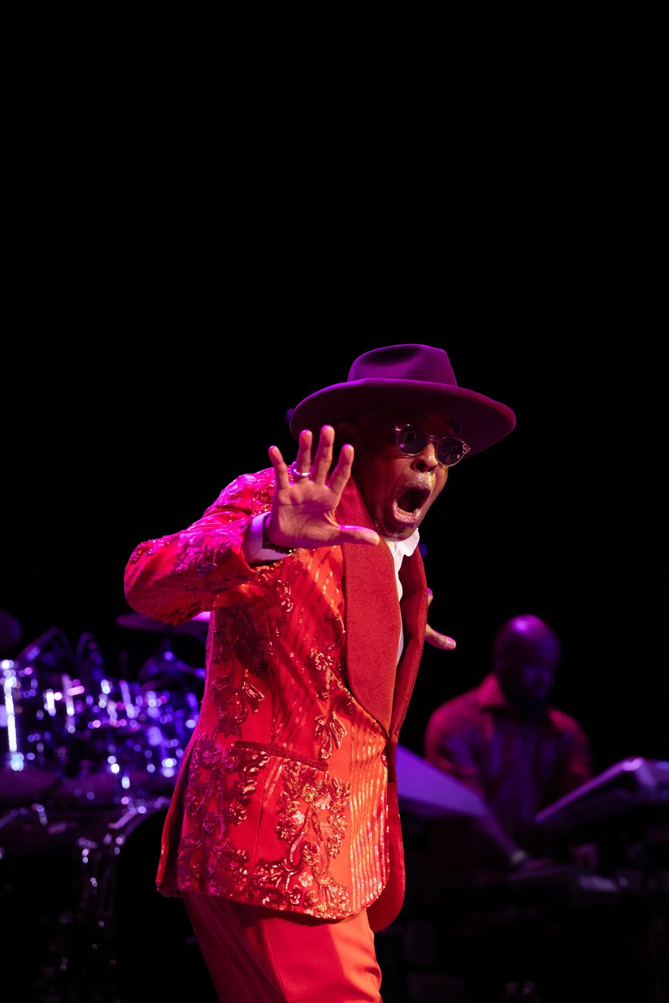 Abdul Ra-oof shouting toward the crowd during SOS Band’s energetic Clowes Memorial Hall performance.