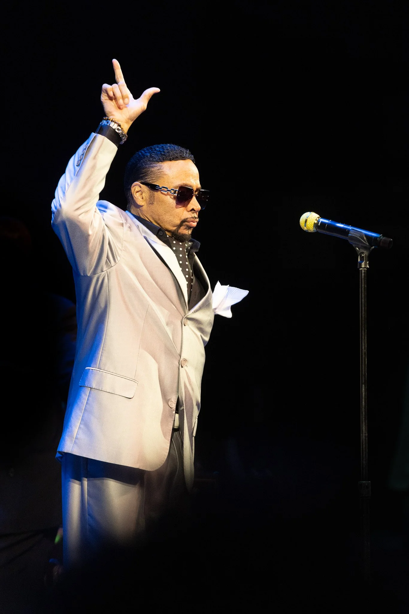 Morris Day holding up a number‑one gesture during his Clowes Memorial Hall performance.