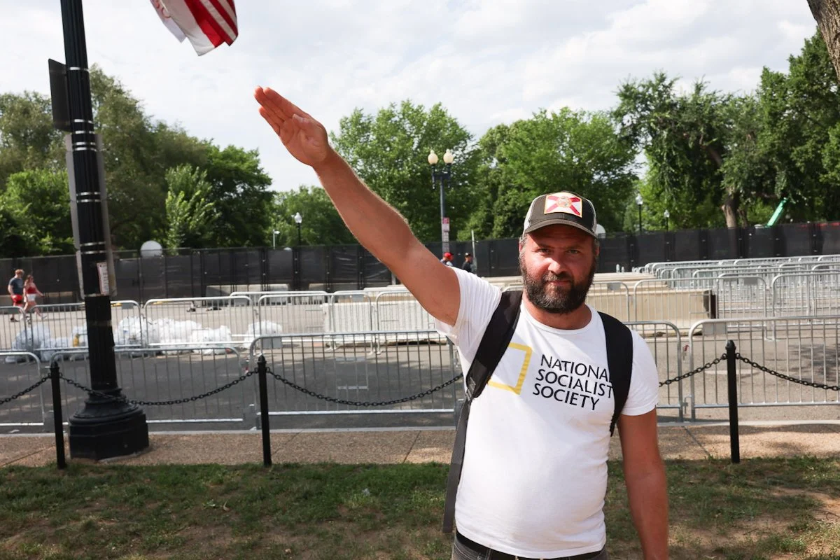 Man in National Socialist Society shirt performing Nazi salute on the National Mall Washington DC June 14 2026