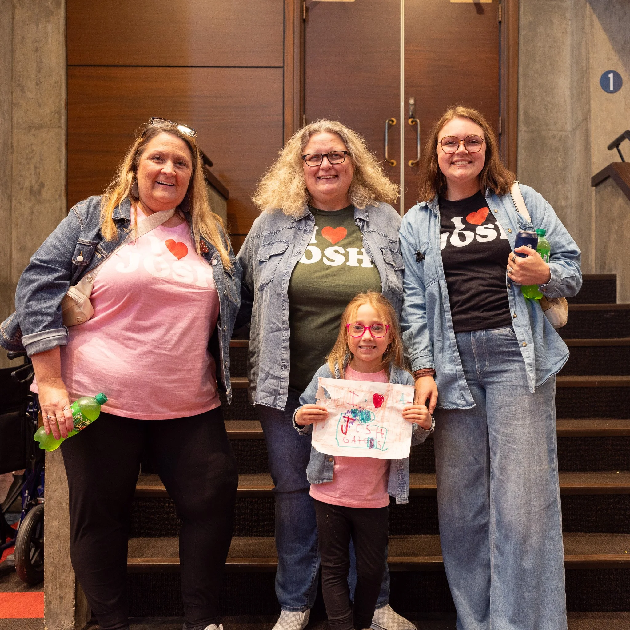 Dedicated Josh Gates fans wearing custom t-shirts at Clowes Memorial Hall in Indianapolis.