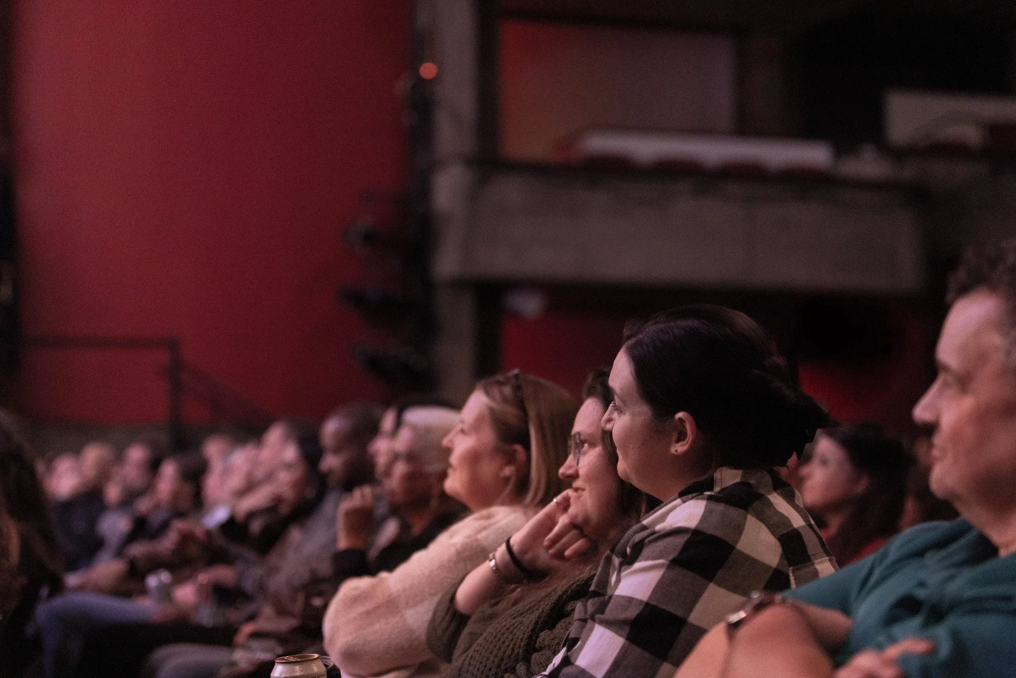 Audience members watch Josh Gates during the Haunted Expeditions show at Clowes Memorial Hall.