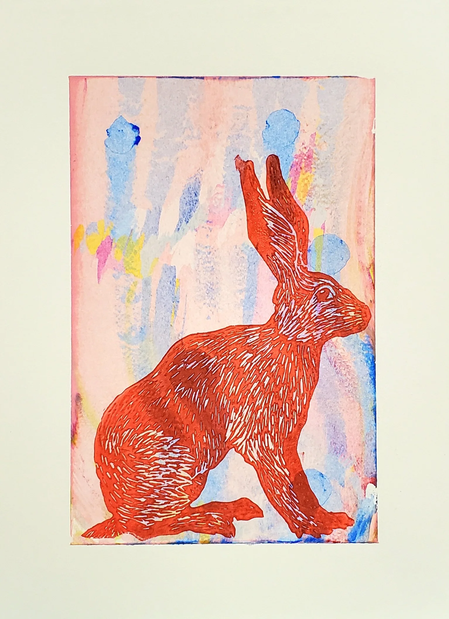 Illustration of a red hare with detailed fur, sitting on its hind legs, on a colorful background of blue, pink, yellow, and purple shades.