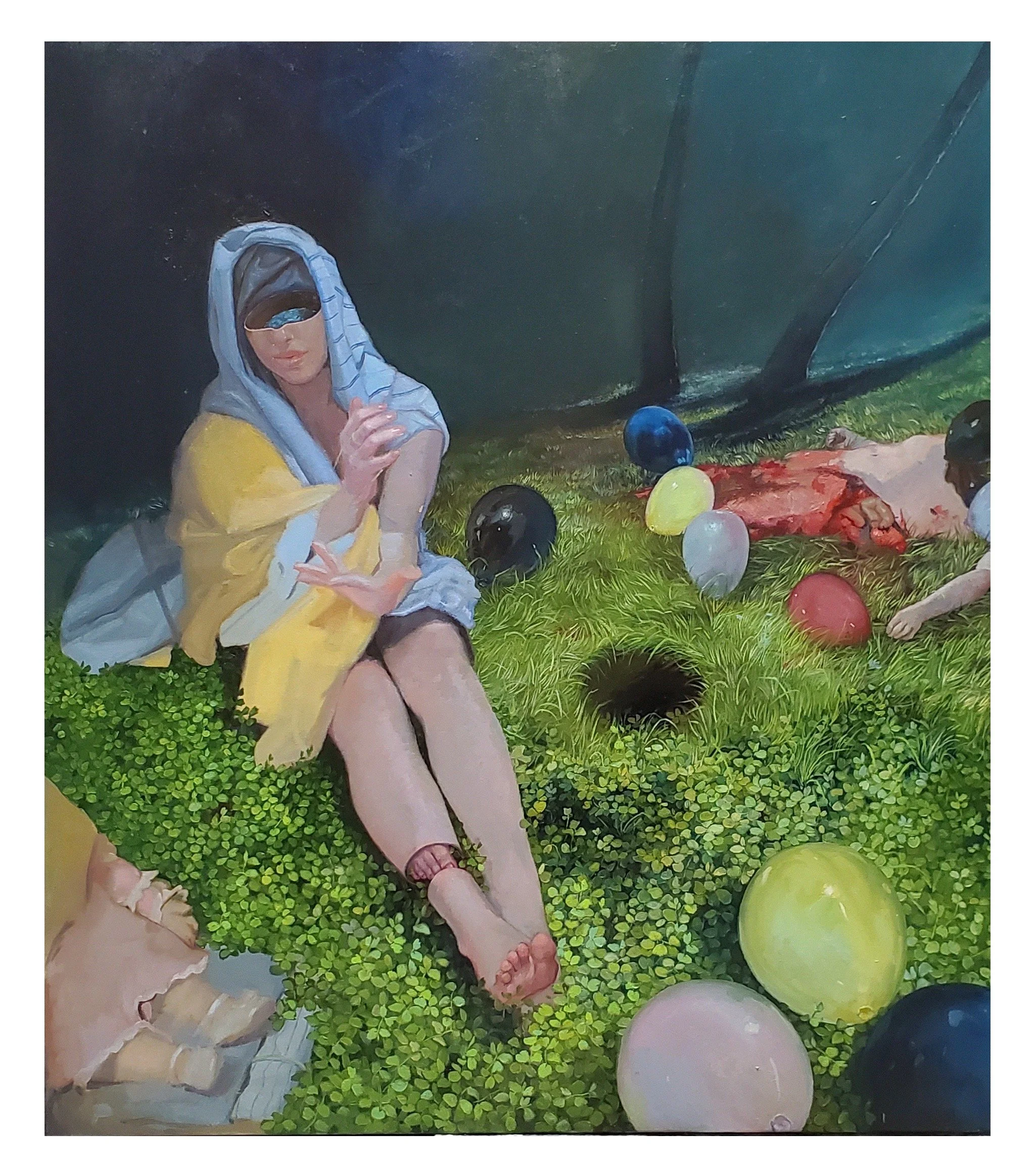A woman sitting on grass surrounded by balloons and greenery, wearing a light-colored dress, a yellow jacket, a cap, and a hoodie, with a bottle in her hand and a person lying next to her with gore near their feet.