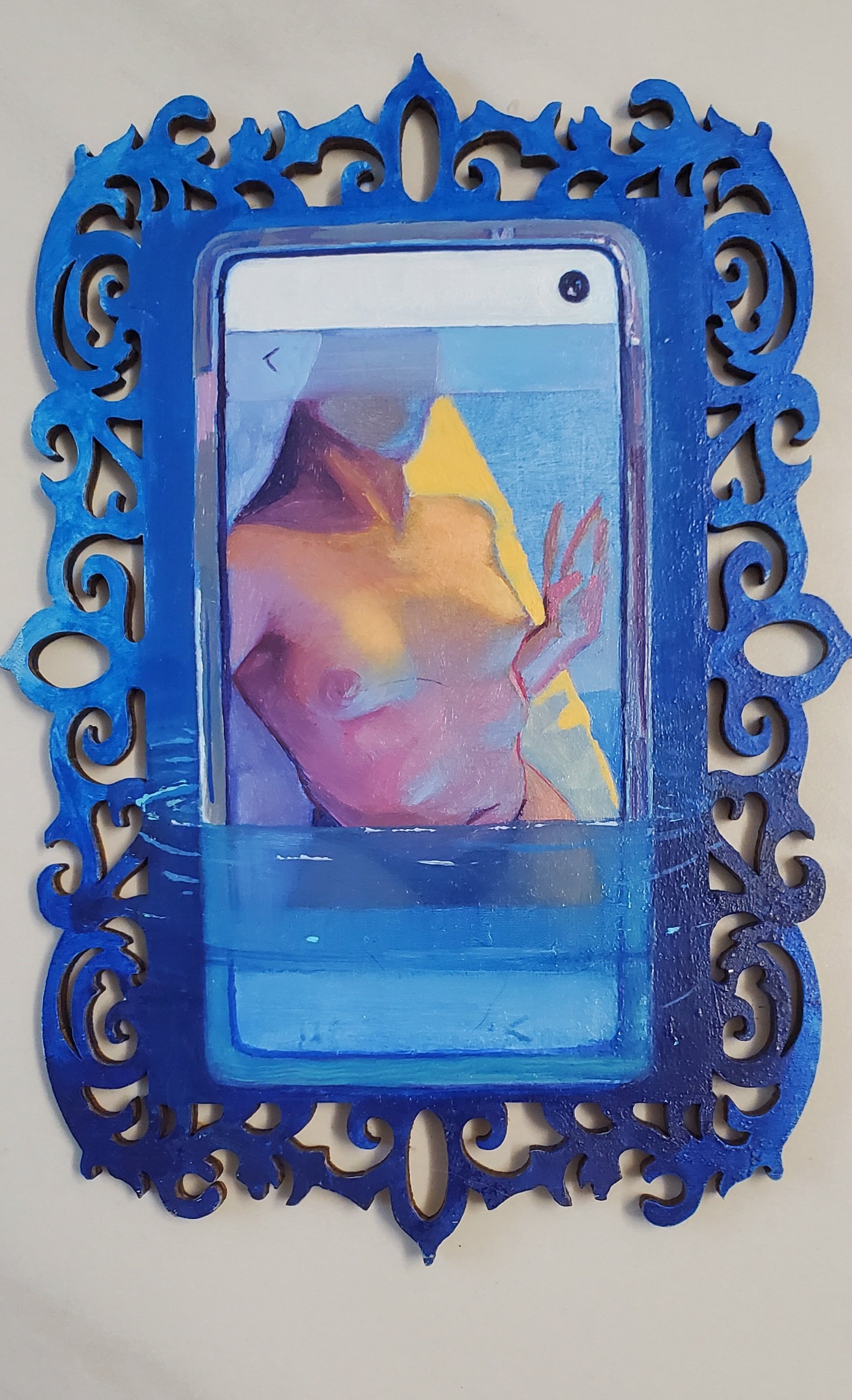 Painting of a nude woman with a hand, framed by an ornate blue frame with decorative scrollwork.