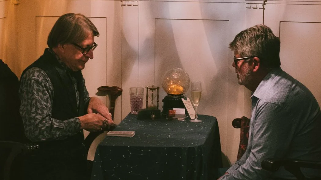Gryphynclyph performing a Tarot reading for a client.
