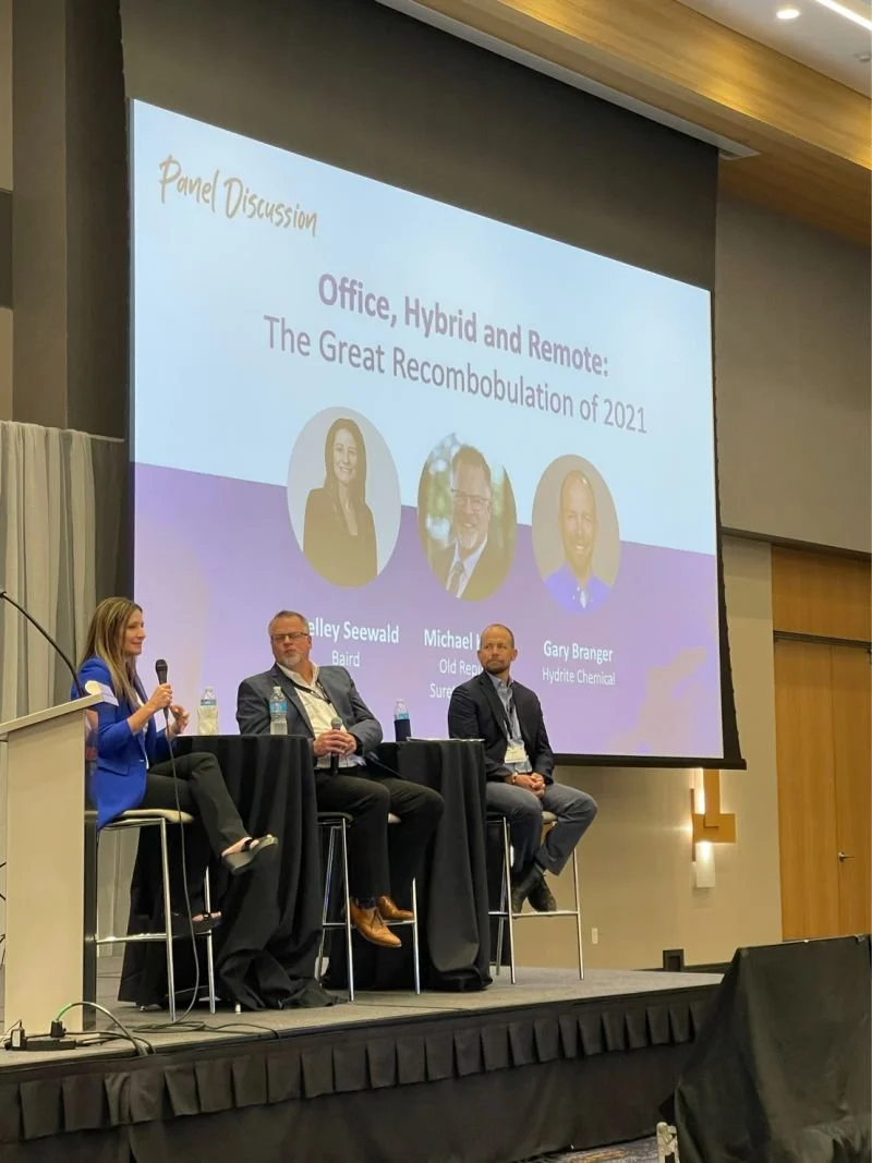 Shelley Seewald moderating a panel discussion at the Wisconsin IT Symposium.