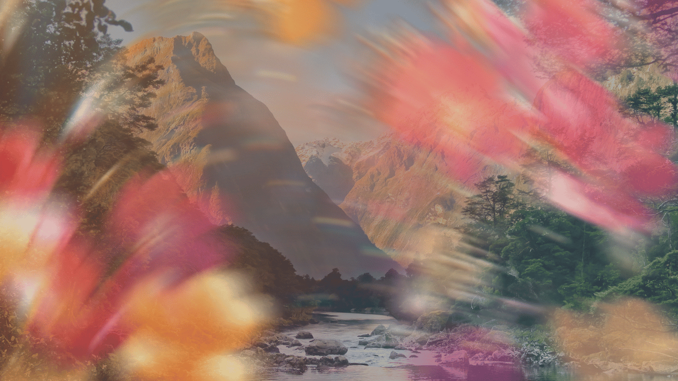 a photo of a river with boulders curves through mountains. Pink, peach, and orange blurred flowers as if in motion overlay the image of the mountains.