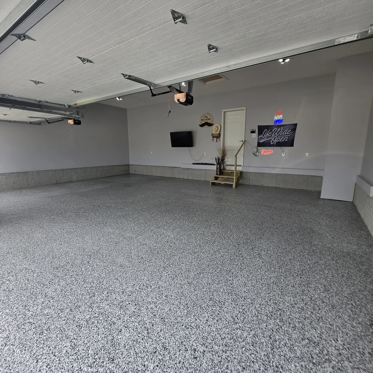 Finished epoxy flake garage floor installed by Elite Garage Pros