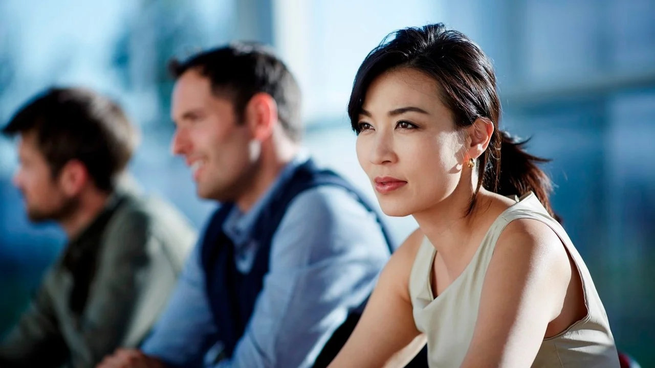 Woman listening in a business meeting