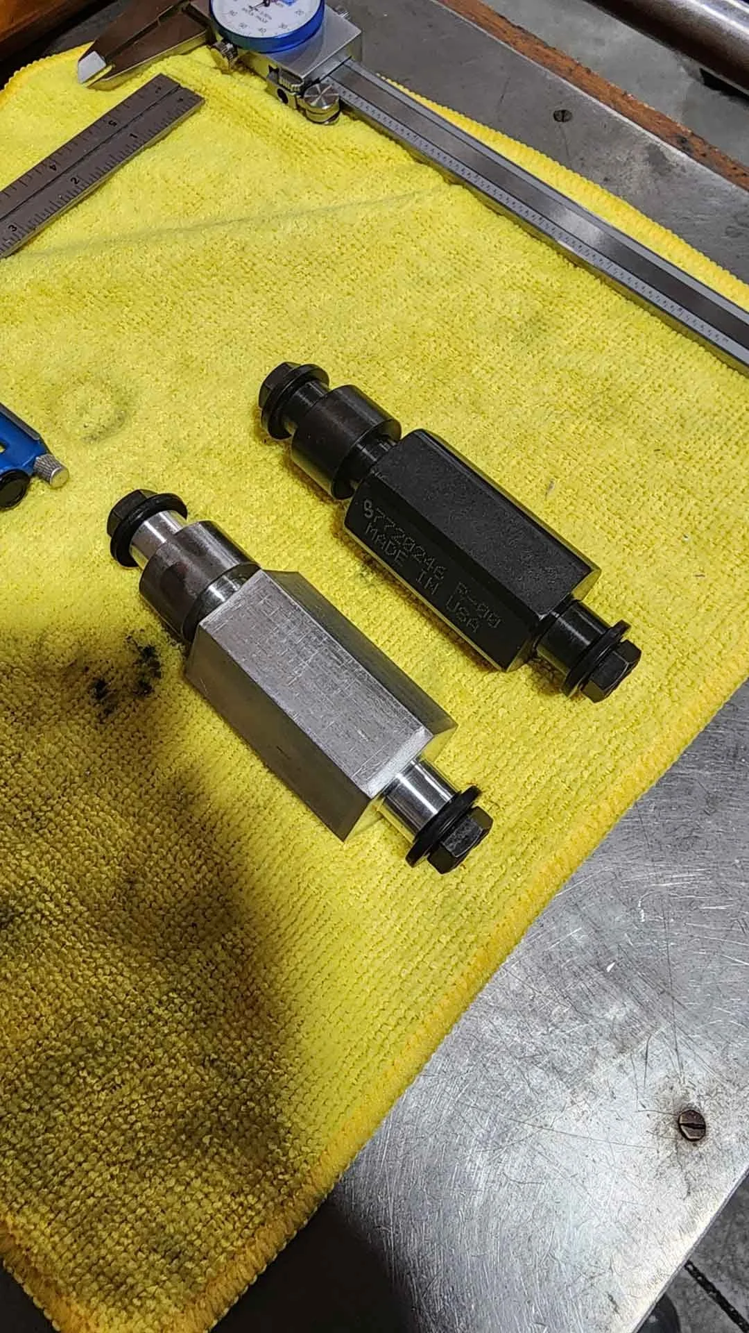 Precision machined cylinders on yellow cloth