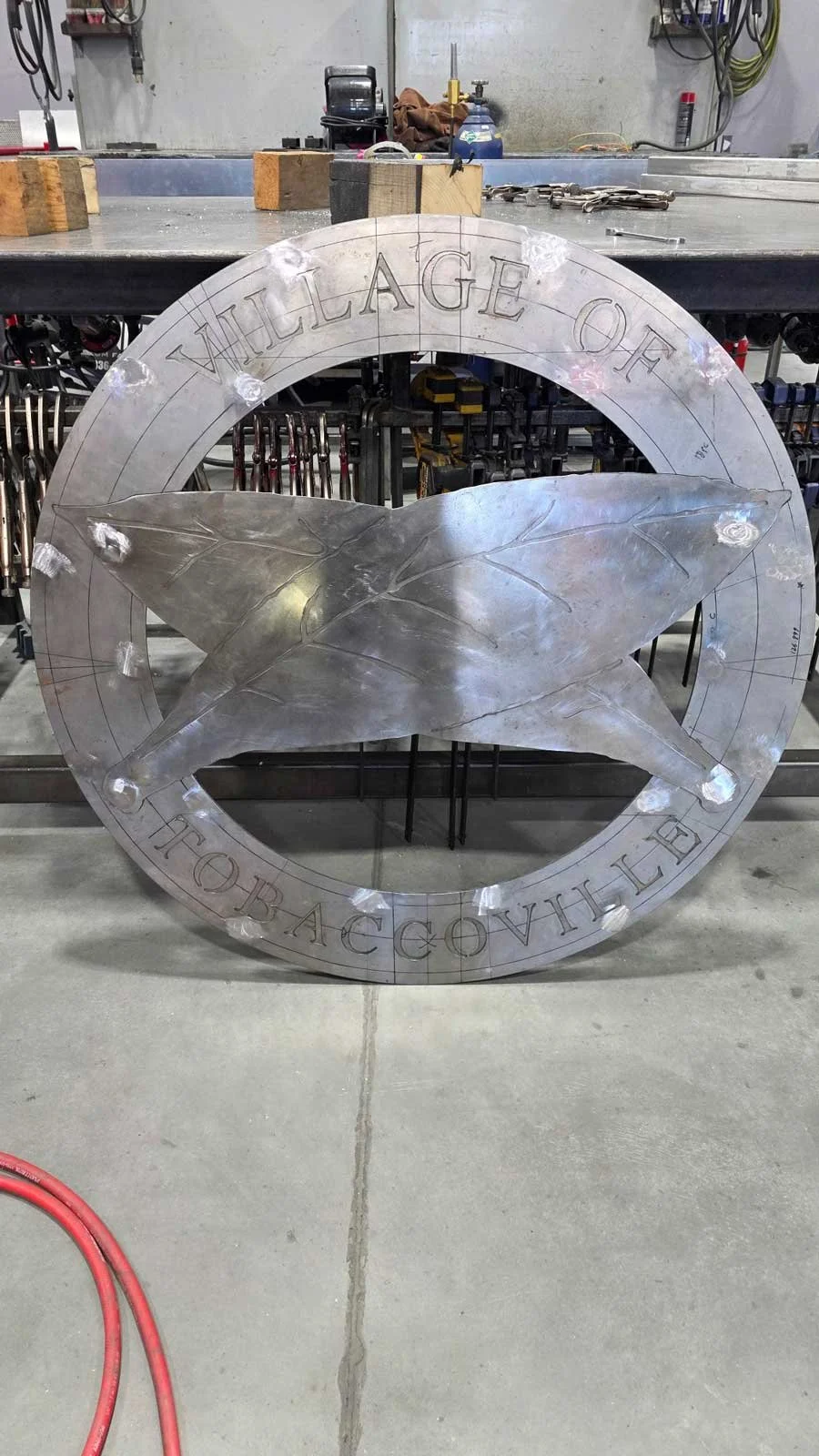Tobaccoville sign before being painted