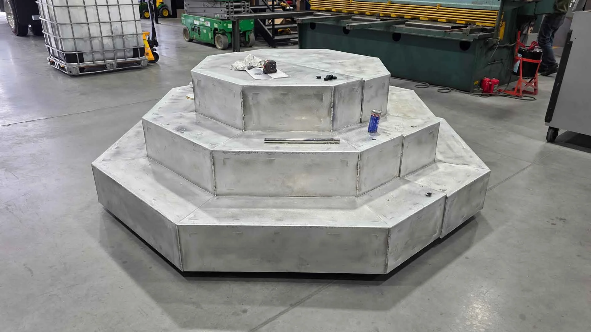 A 3-stepped octagonal platform designed to serve as a mobile stage for marketing events