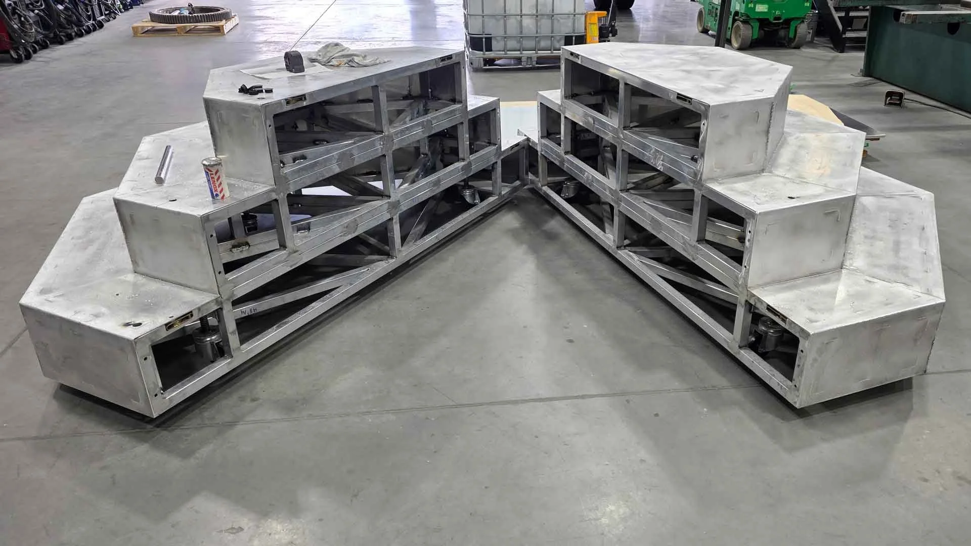 An exploded view of a 3-stepped octagonal platform designed to serve as a mobile stage for marketing events