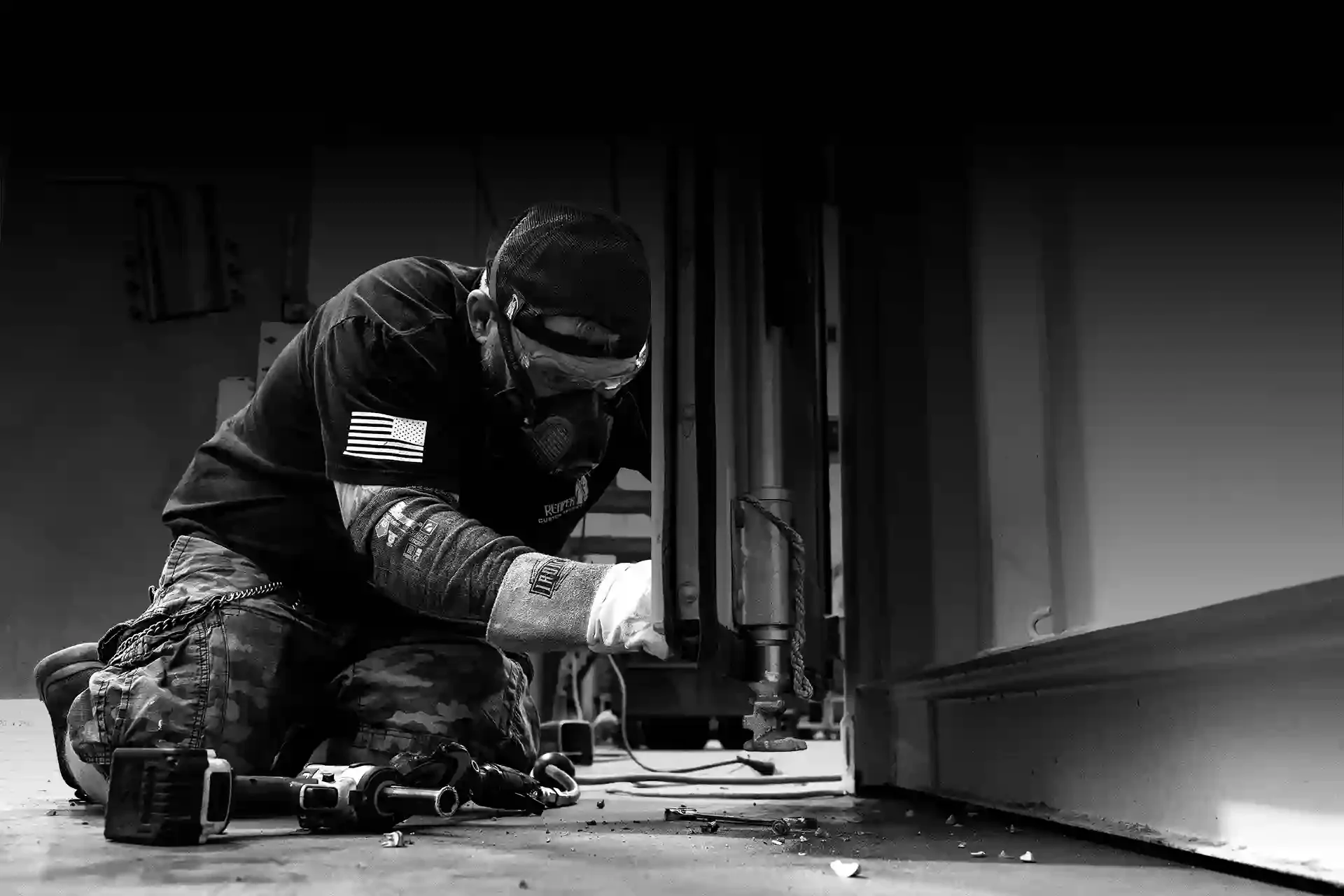 A Reaper technician making final adjustments to components of an experiential marketing display