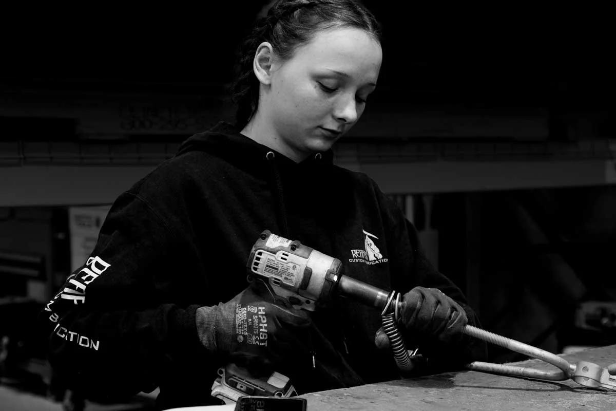 A skilled technician fabricating one of the many fence components that Reaper manufactures