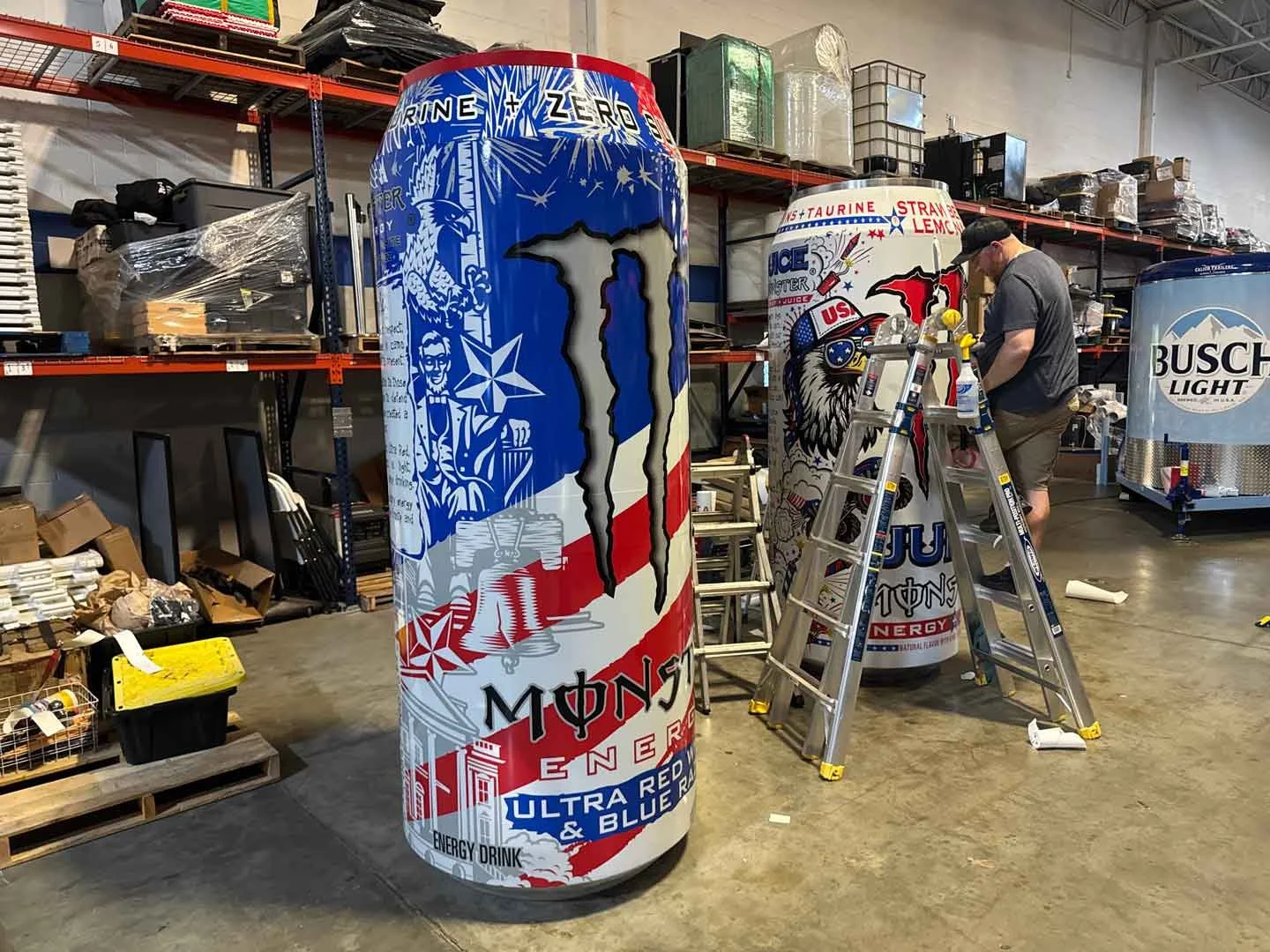 Monster drink experiential marketing display showing giant cans