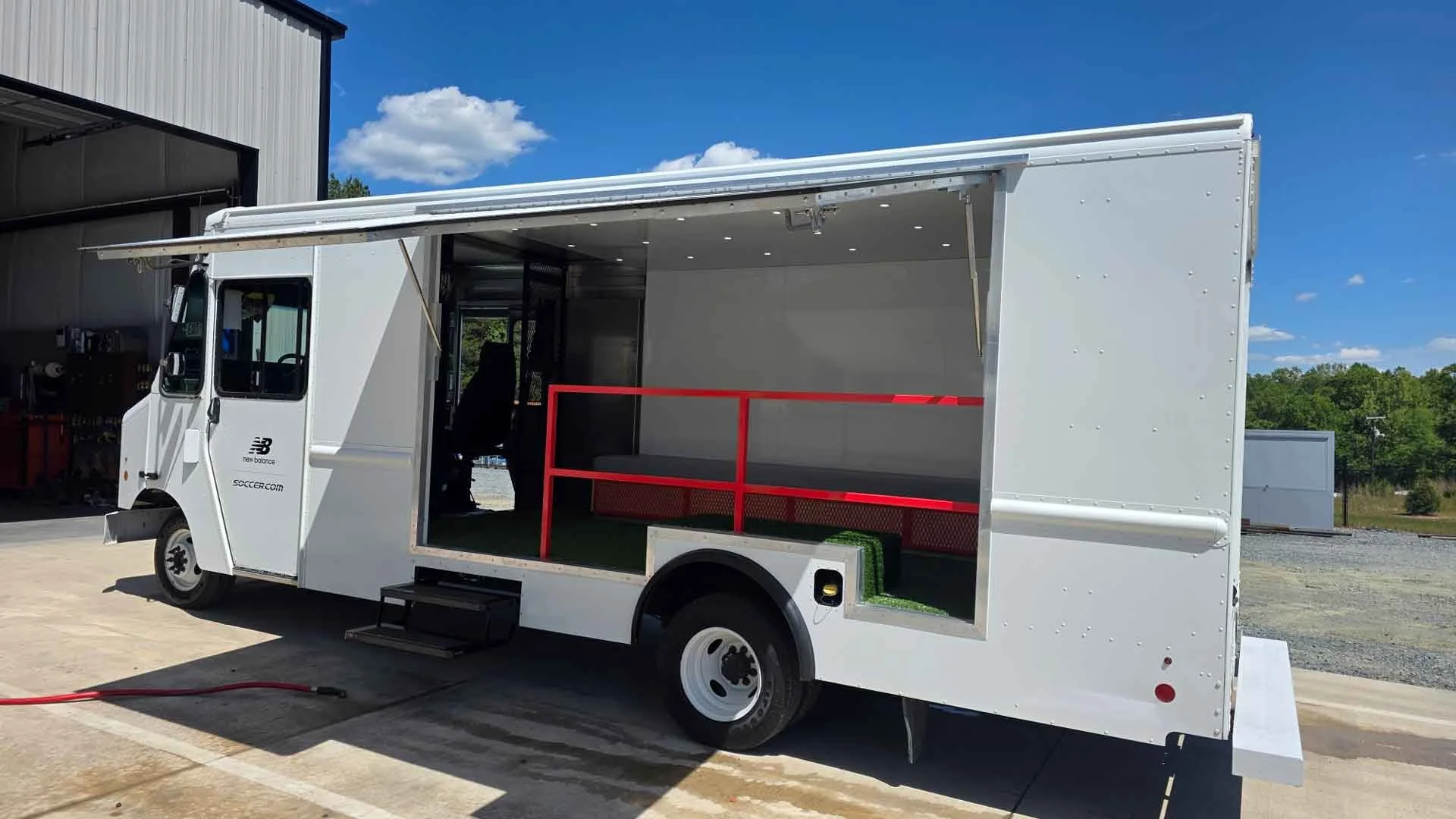 Mobile experiential marketing display before graphics application