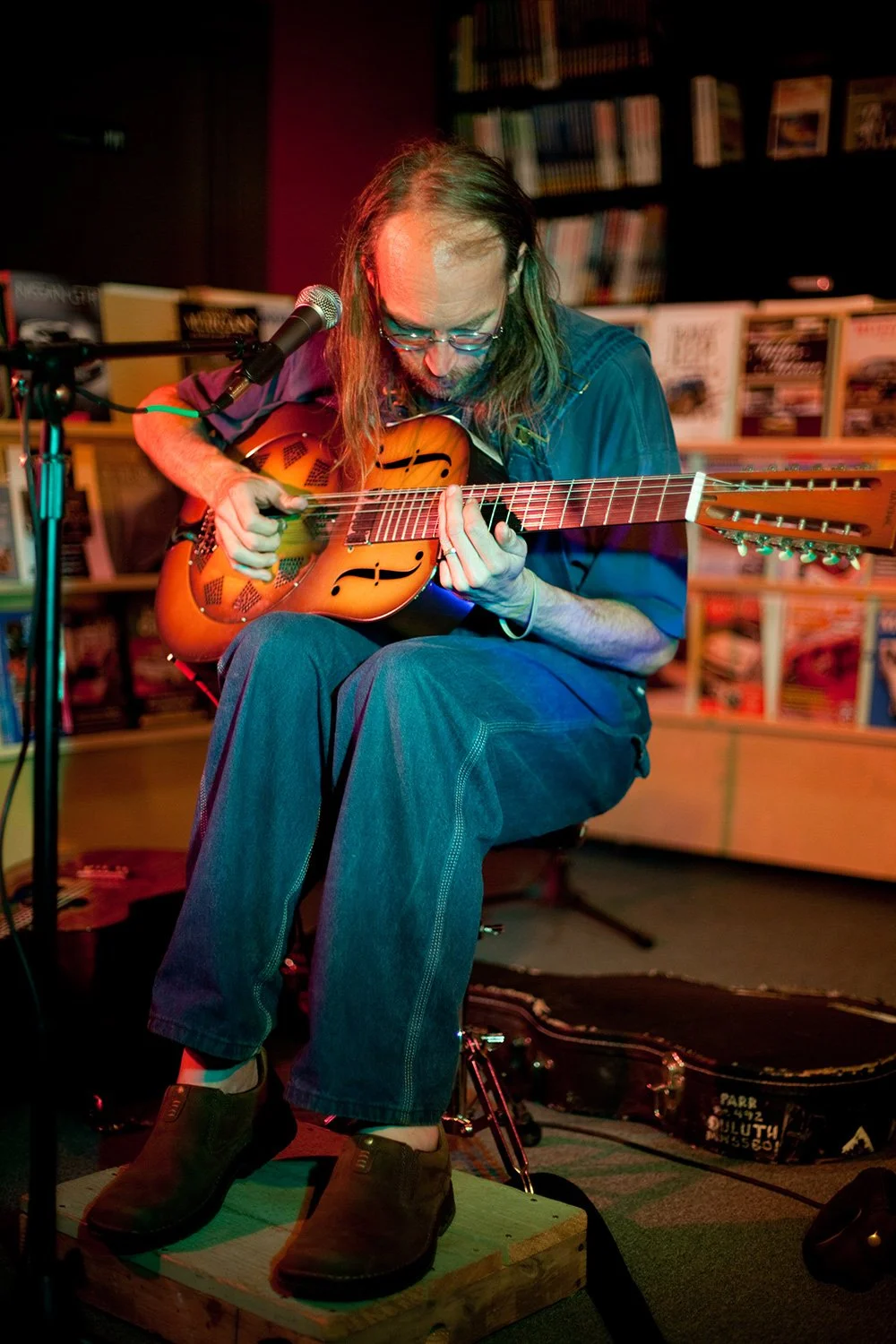 Charlie Parr performing on dobro during a Hickory Arts House Concert in Hickory, NC, representing resonator guitar instruction, Americana, folk, and bluegrass musicianship.