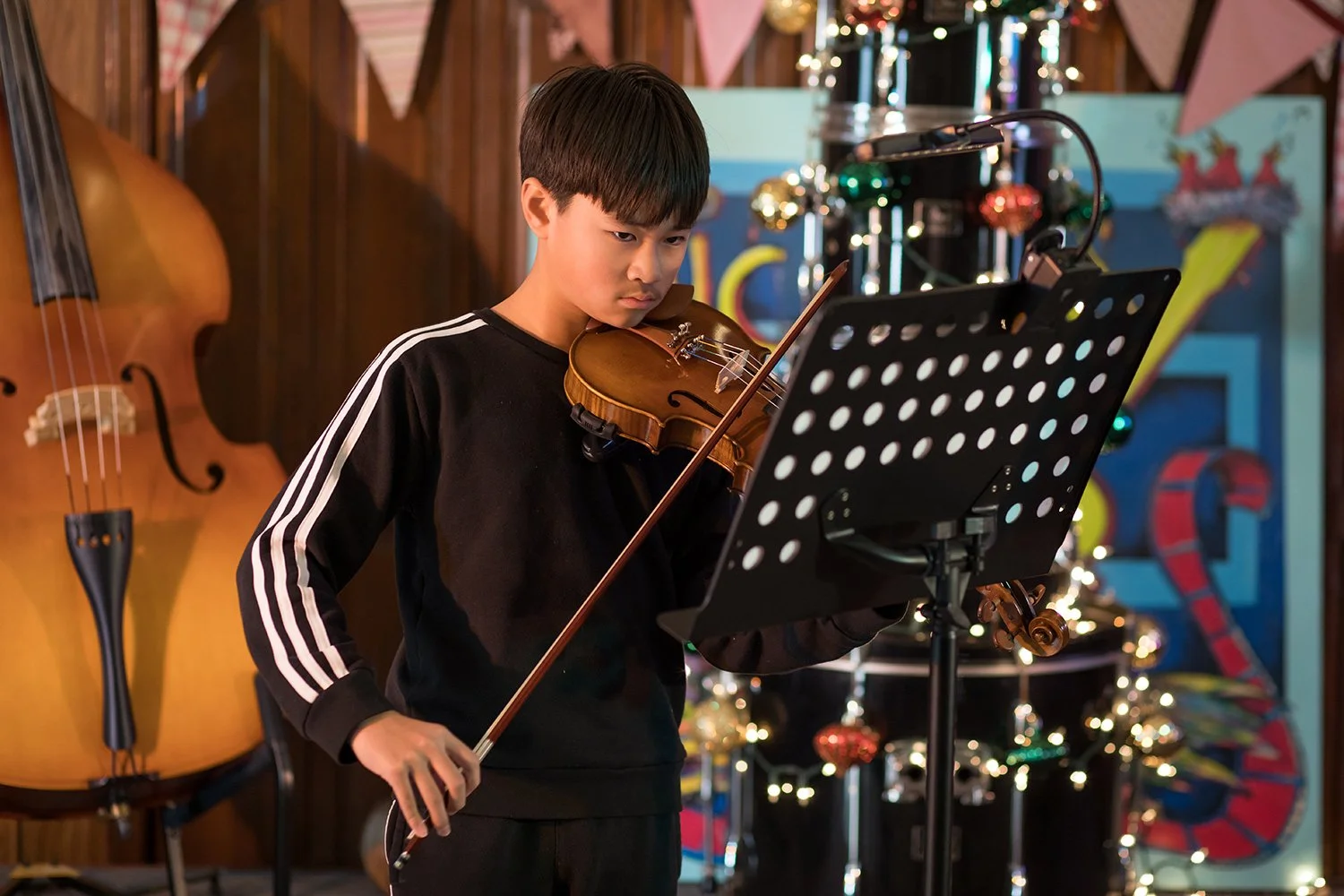 Student performing on viola during a Hickory Arts lesson and recital program in Hickory, North Carolina, developing technique, ensemble skills, and expressive musicianship.