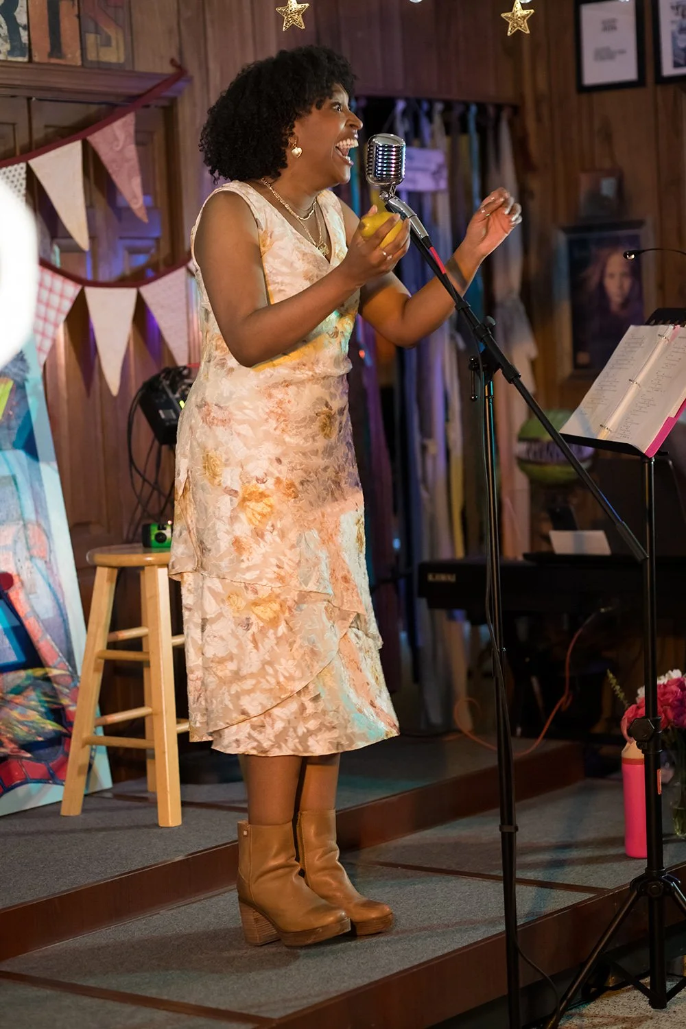 Singer performing live during a Hickory Arts house concert and artist development session.