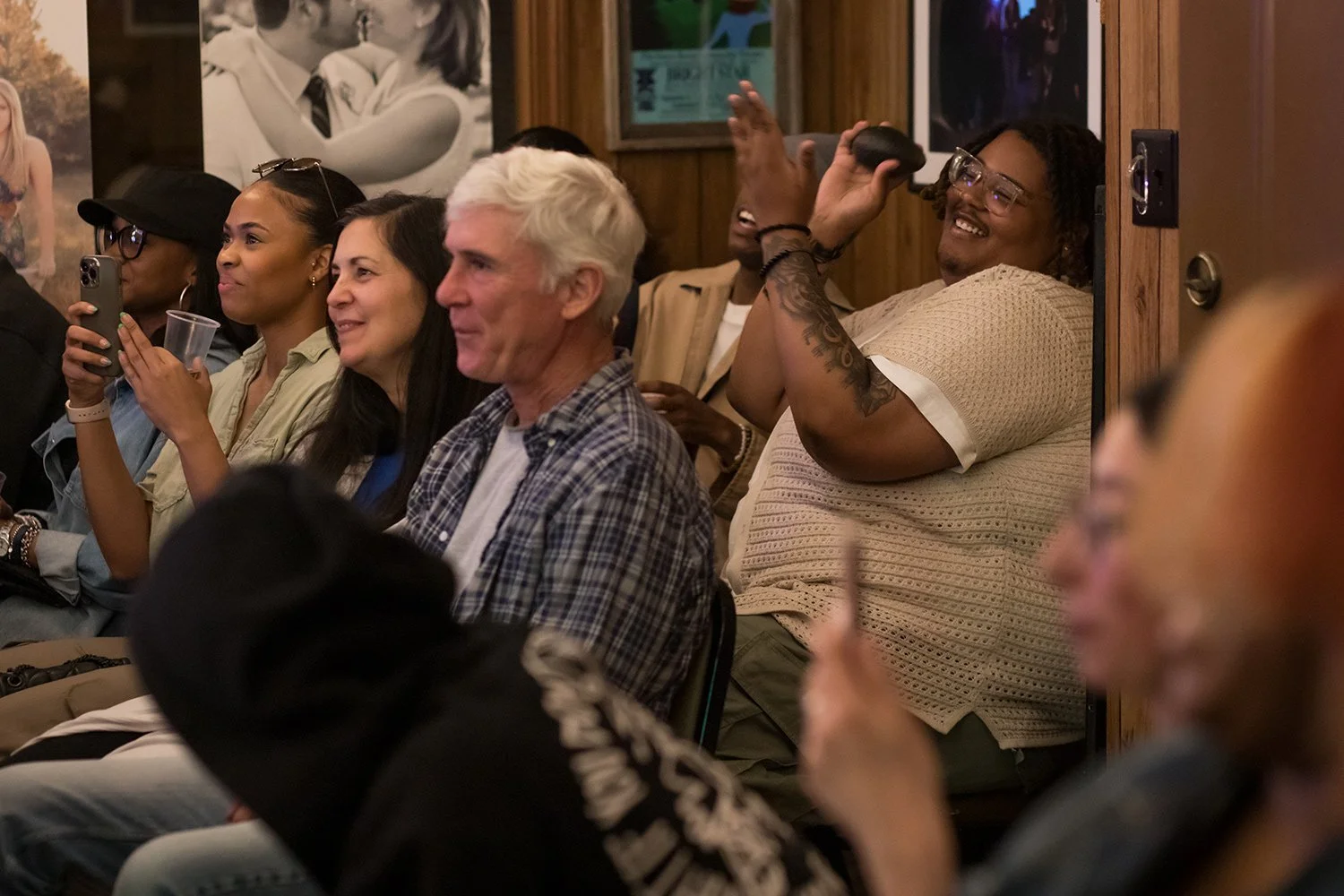 Audience members enjoying an intimate live music performance during a Hickory Arts House Concert in Hickory, NC.