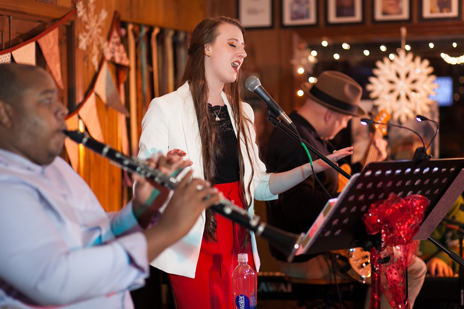 Savannah Spencer performing live during a Hickory Arts house concert while developing skills in singing, songwriting, and live performance in Hickory, NC.