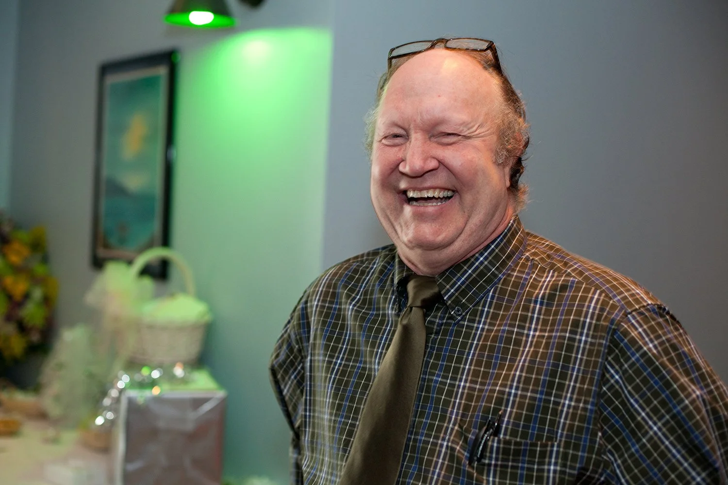 Portrait of Technical Director Clay James smiling during a Hickory Arts event in North Carolina with soft lighting and a welcoming creative atmosphere.