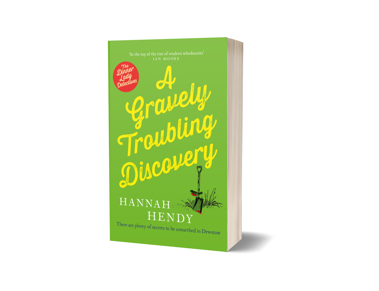A book titled 'A Gavelly Troubleshooting Discovery' by Hannah Hendy with a green cover, red circle noting 'The Dinner Lady Detectives,' and an illustration of a small shovel and grass.