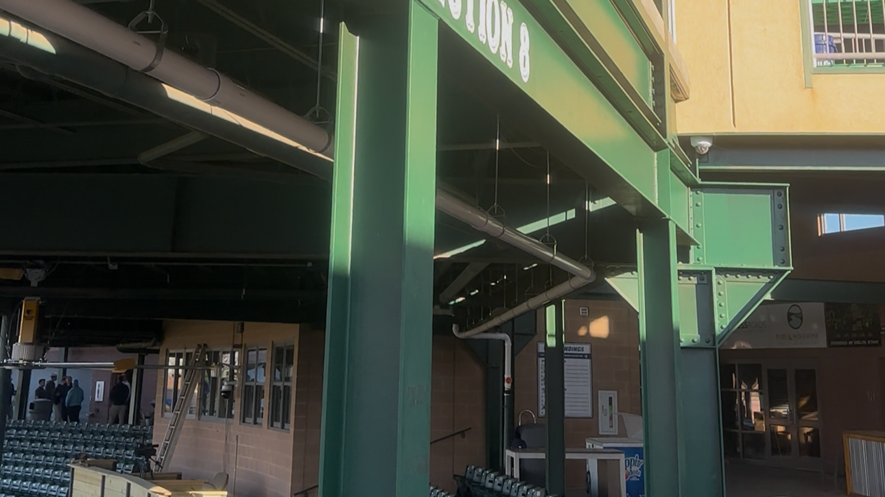 Oranssi technician working on a roof project