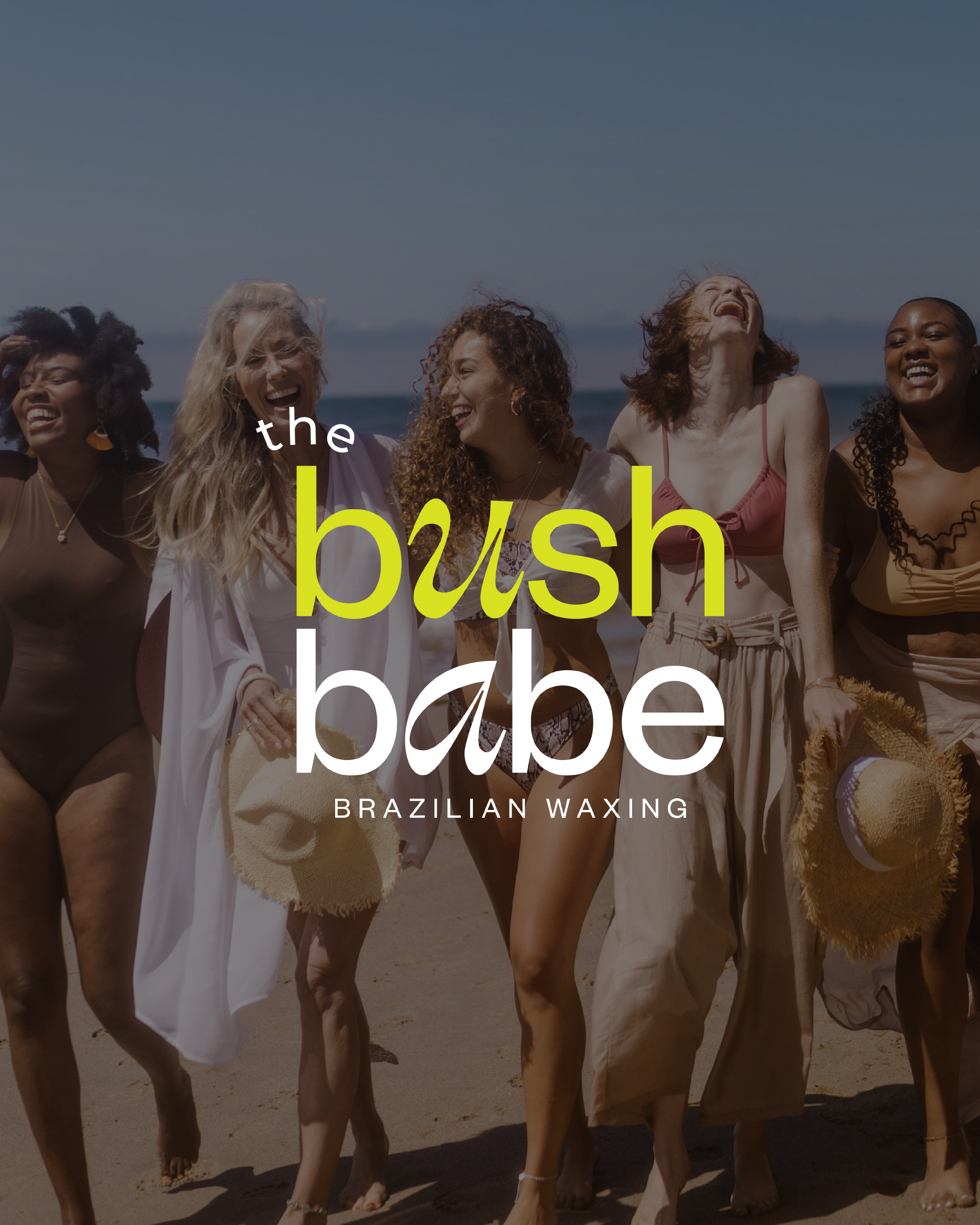 A group of women walking on the beach, laughing and enjoying themselves. They are dressed in summer clothing and appear to be happy.