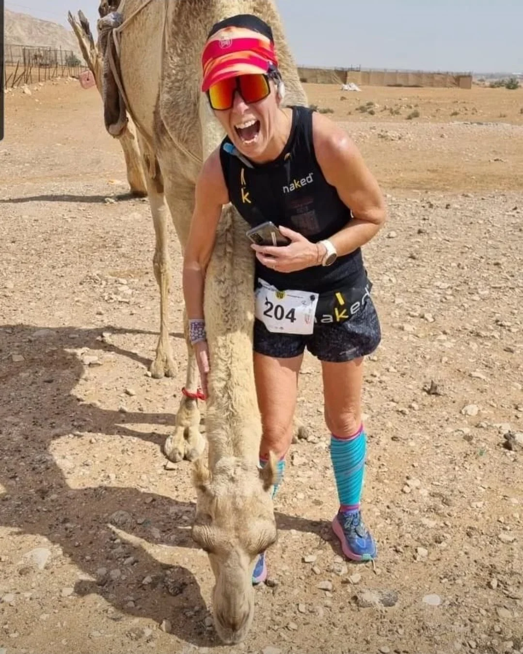 Jo petting camel mid race.jpg