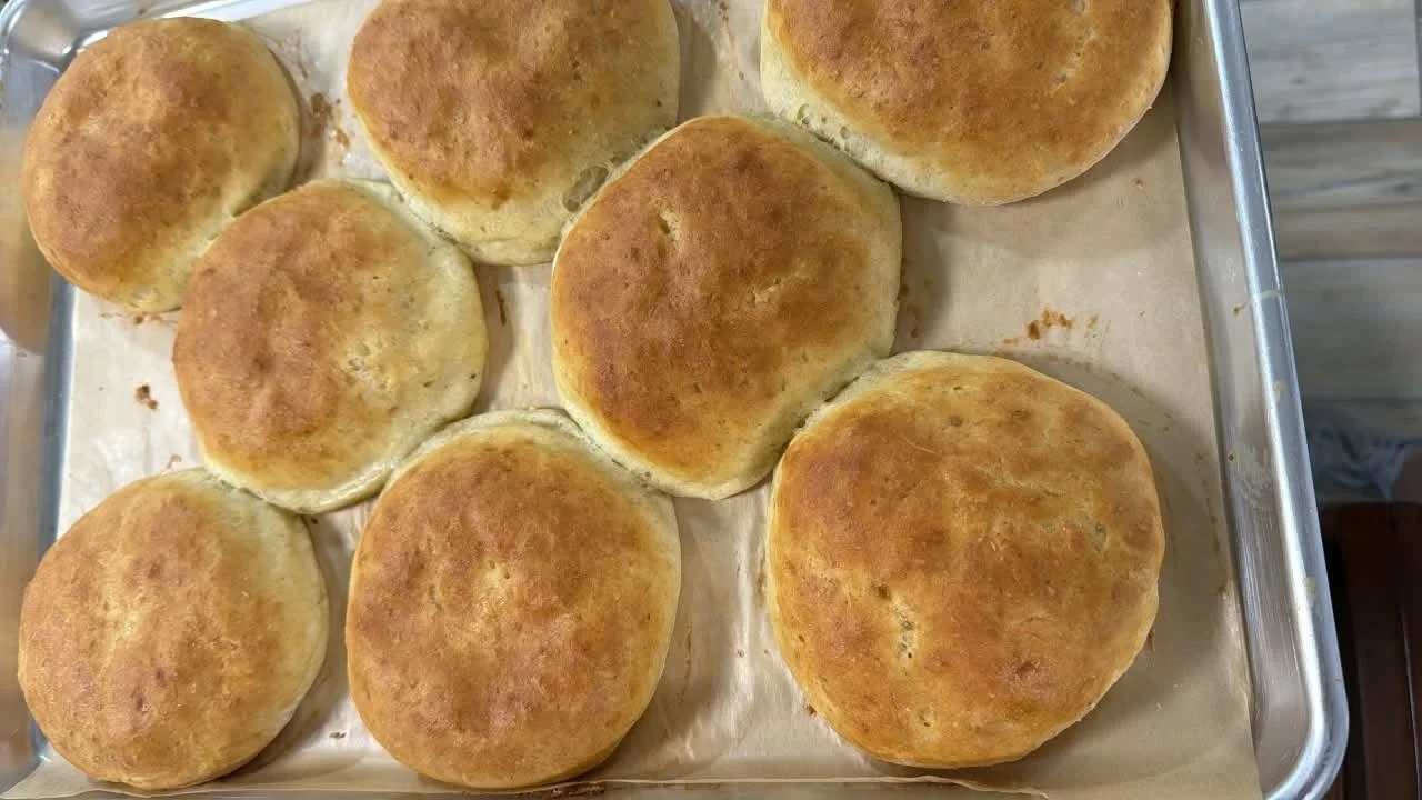 Multiple hamburger buns on a tray