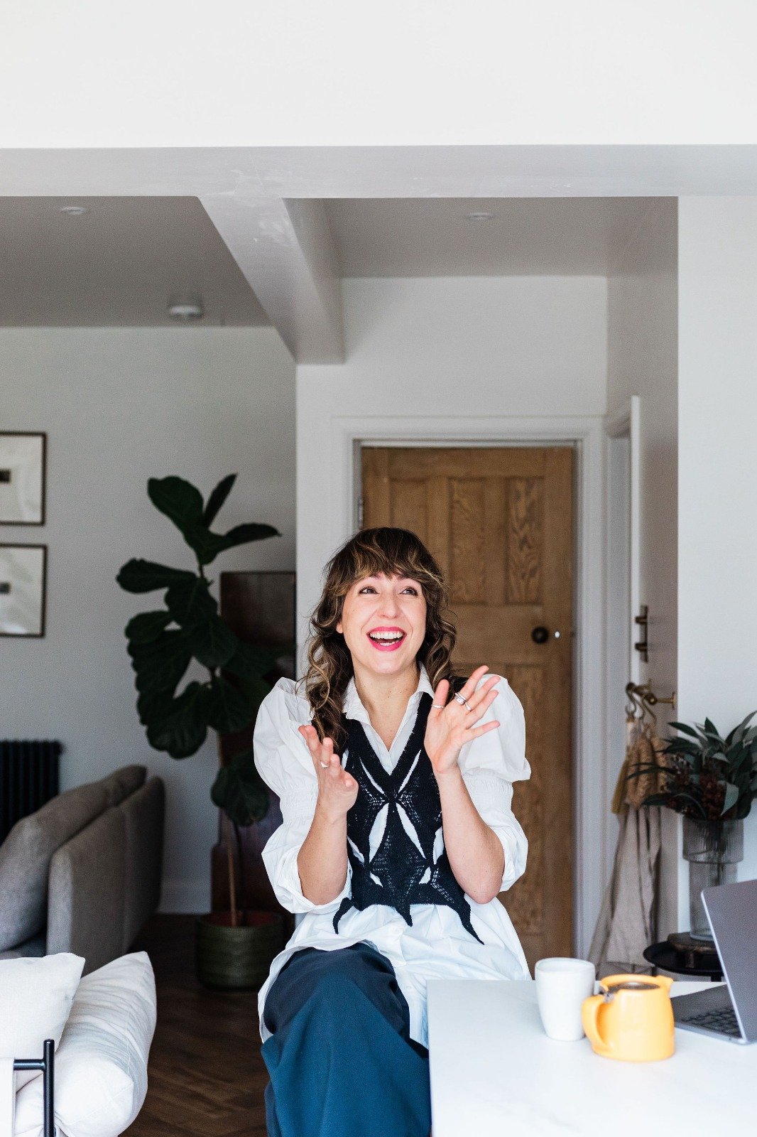 Becs Pearson, copywriter, laughing and clapping