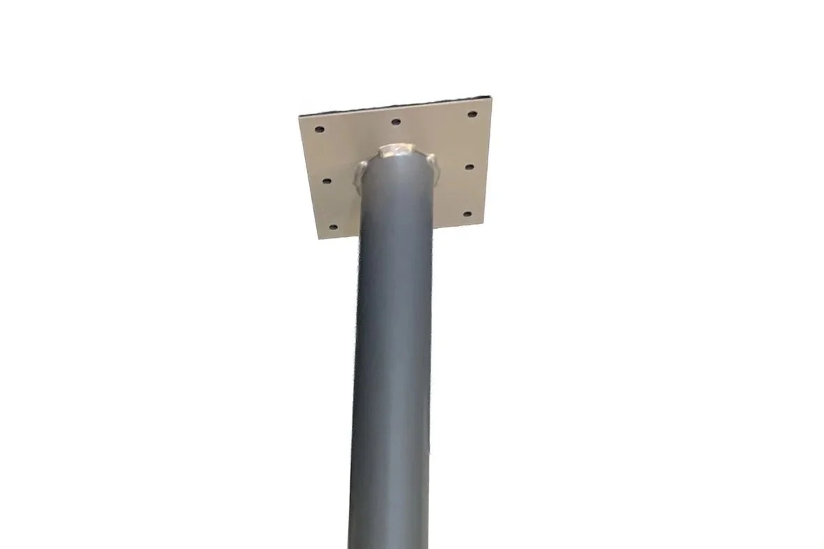Close-up of a metal base attached to a square metal base plate.