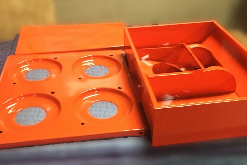 Orange powder coated components.