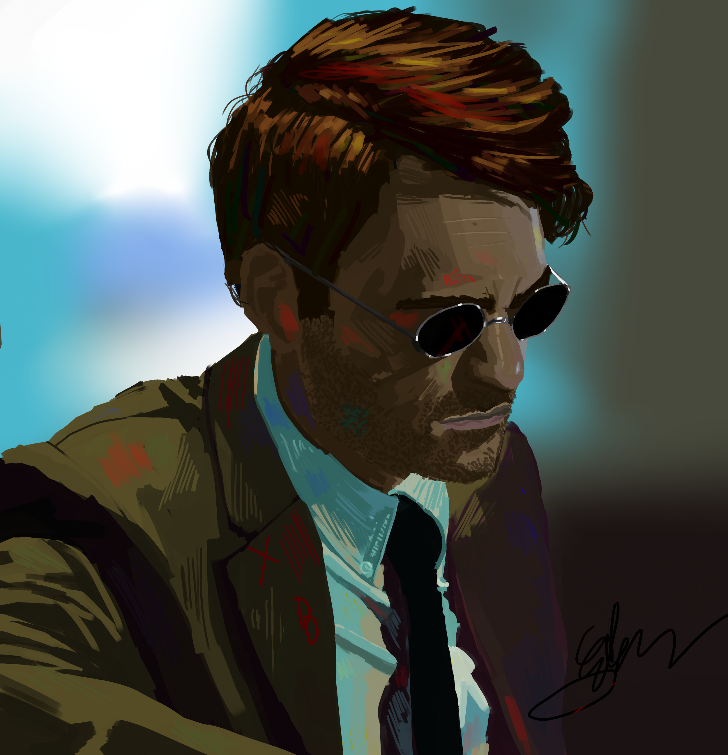 Brown haired man with sunglasses and a brown suit in tie, sitting in front of a blurry blackground.