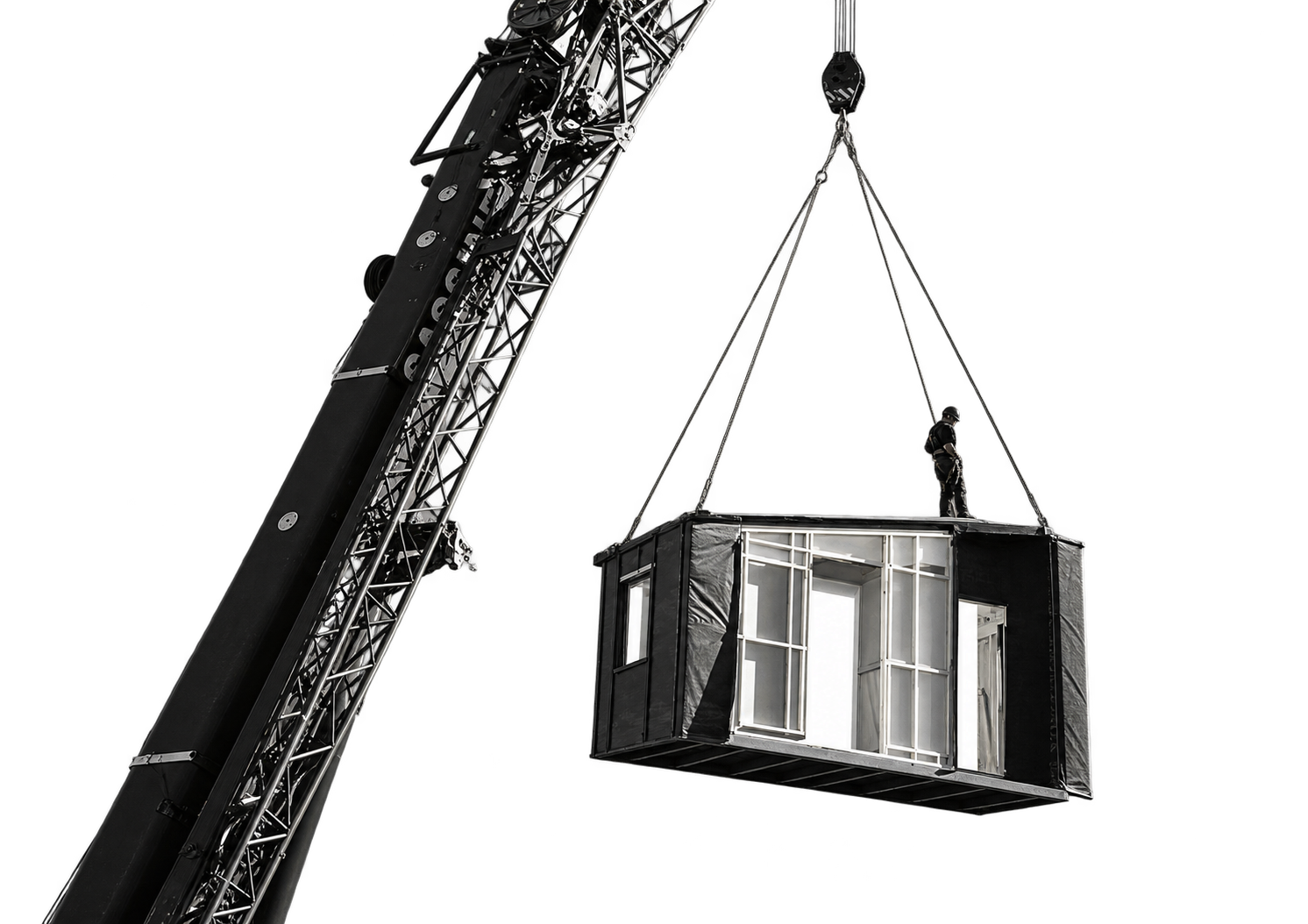 A person standing in a suspended glass structure being hoisted by a crane against a black background.