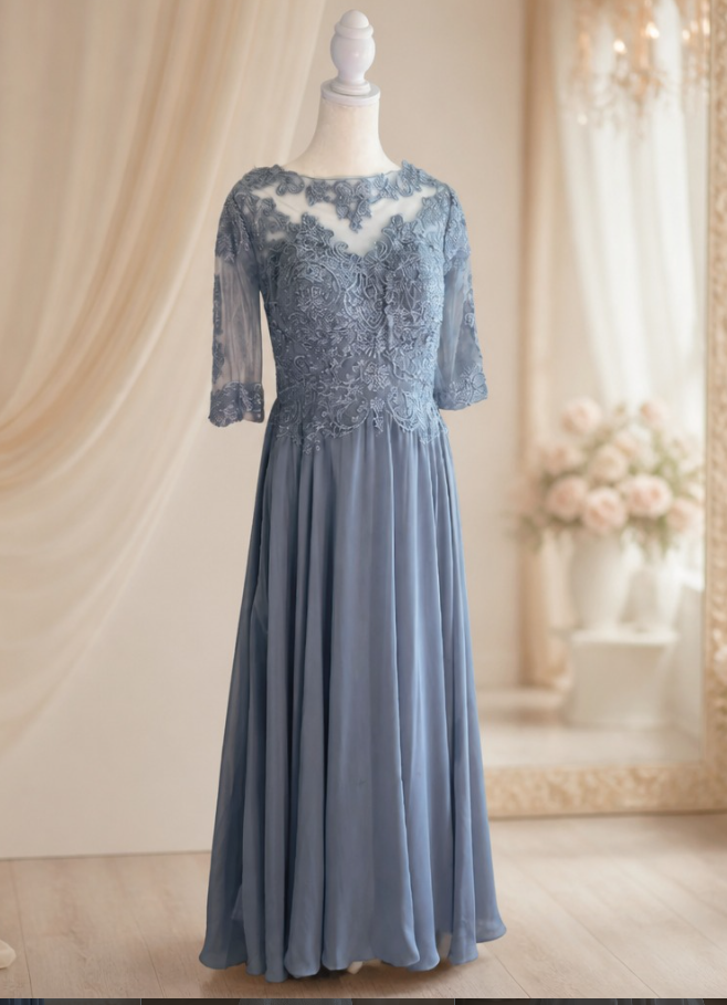 A blue lace and satin dress displayed on a mannequin in a softly lit room with floral decor.