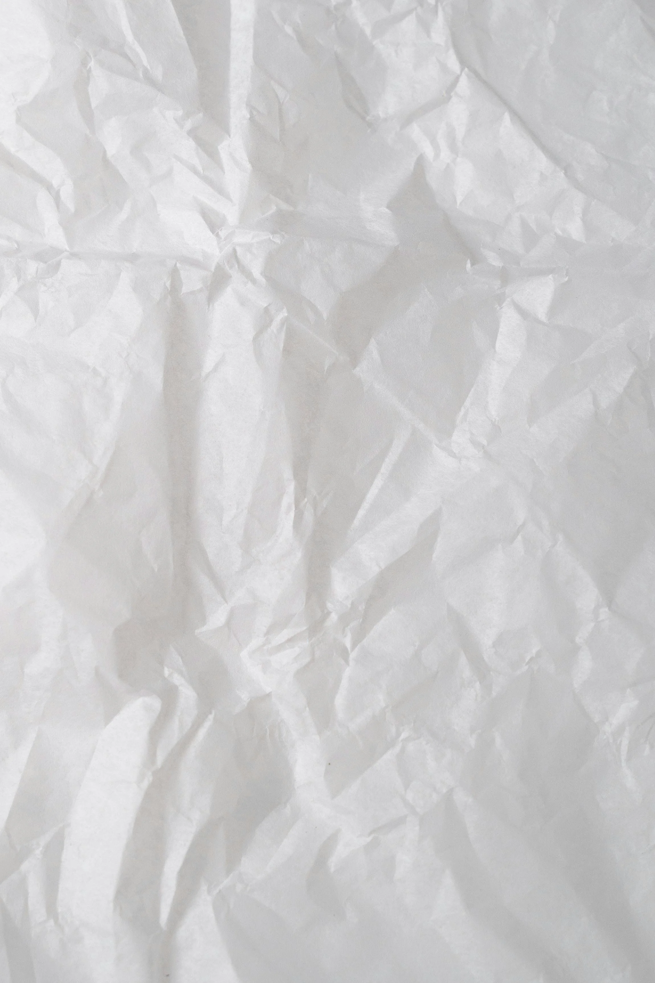 Crumpled paper receipts representing financial overwhelm for small business owners