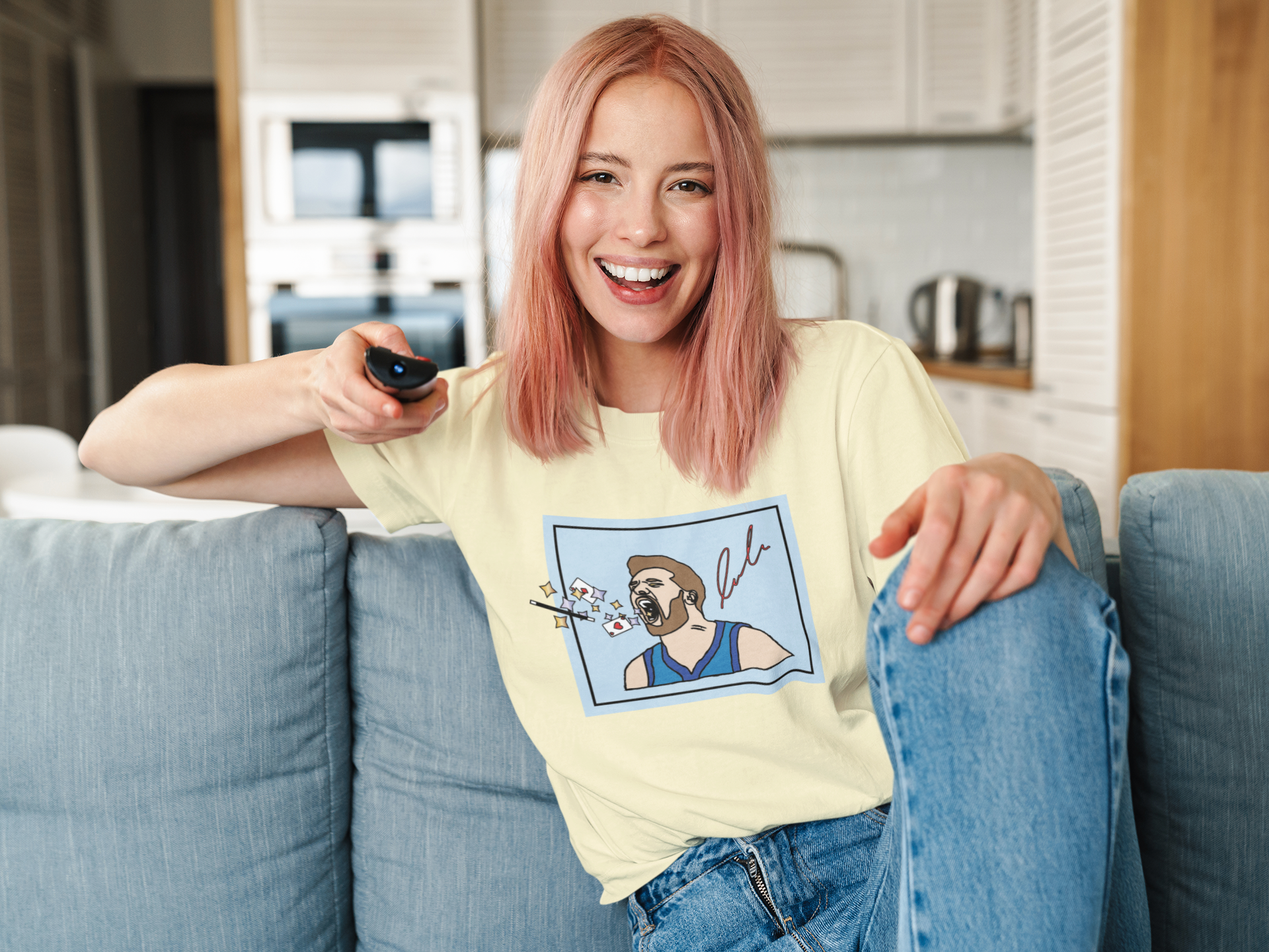 mockup-of-a-woman-with-a-unisex-t-shirt-holding-a-tv-remote-41274-r-el2.png