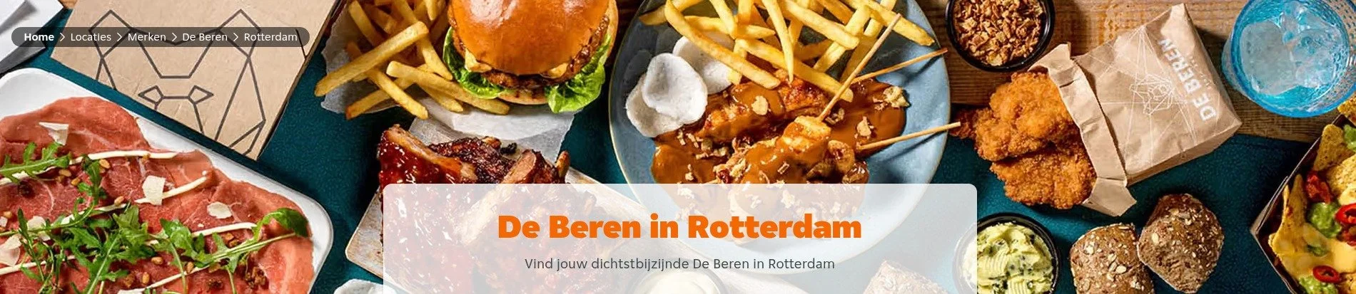 Diverse gerechten en snacks op een tafel in Rotterdam, waaronder een hamburger, friet, kipnuggets, verschillende sauzen, vleeswaren en groentesalades.