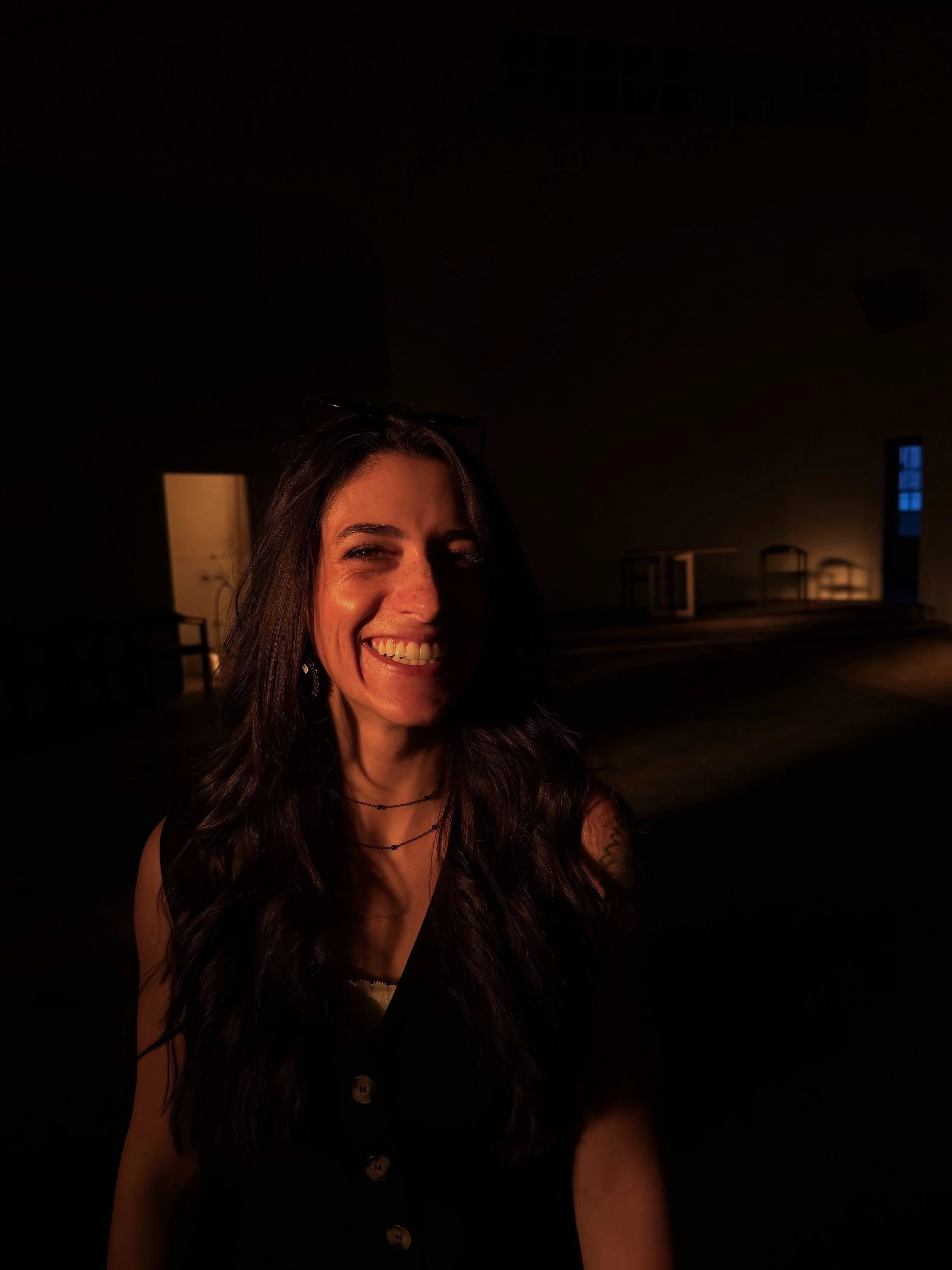 Amber Monaco with straight teeth laughing at golden hour