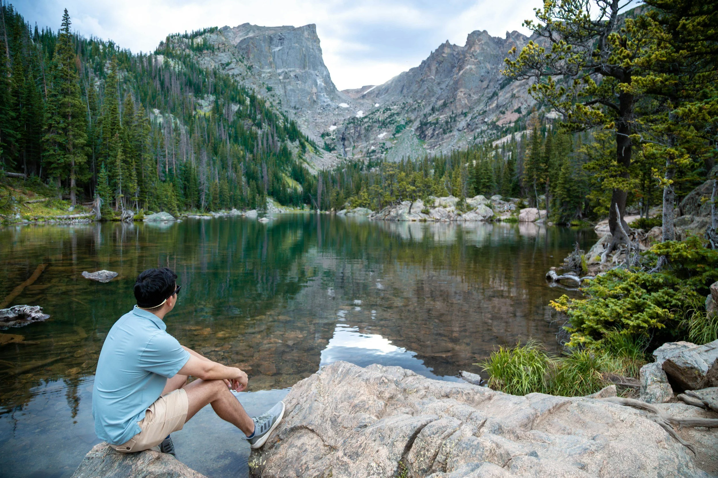 Guest sitting by Dream Lake