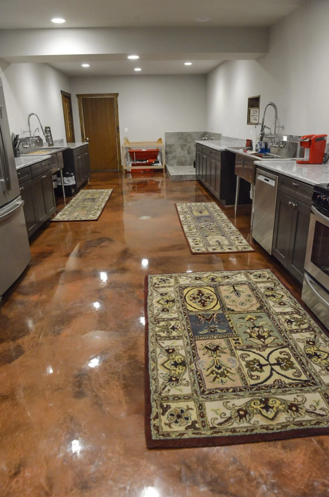 Copper amber metallic epoxy floor coating in basement kitchen in Bull Valley IL